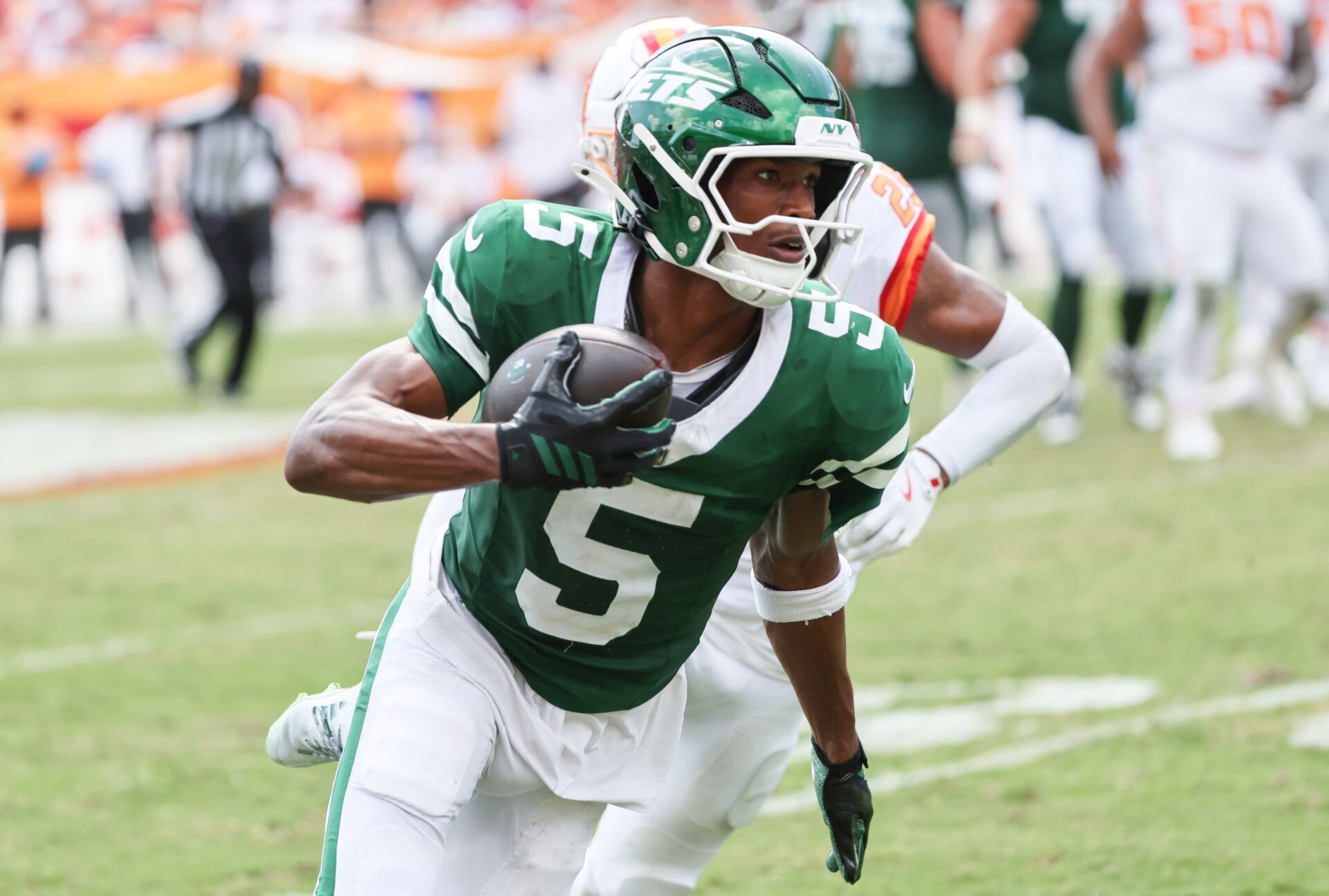 New York Jets wide receiver Garrett Wilson (5) runs with the ball against the Tampa Bay Buccaneers during the second half at Raymond James Stadium.