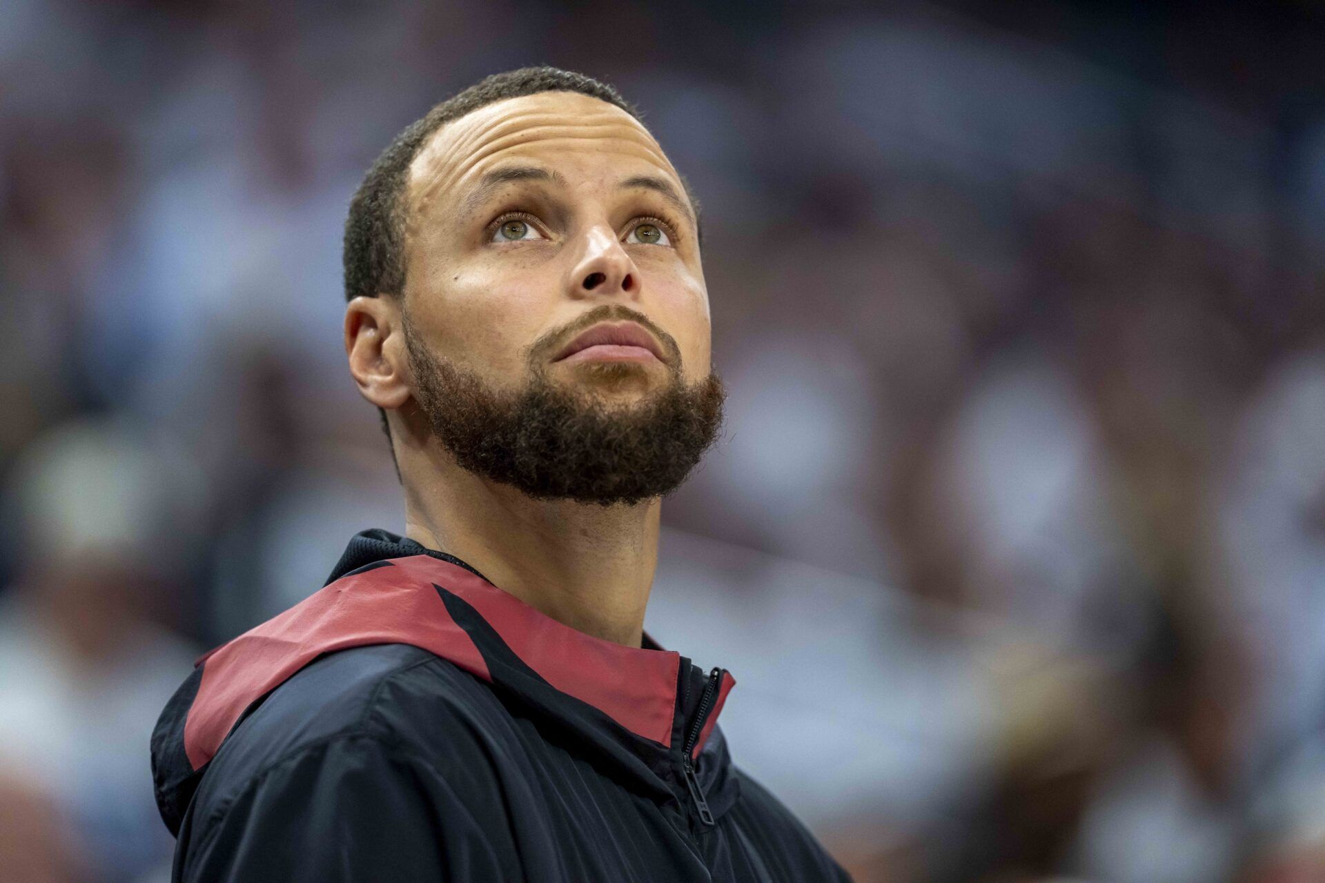 Golden State Warriors guard Stephen Curry (30) looks on from the bench against the Minnesota Timberwolves in the second half during game two of the second round for the 2025 NBA Playoffs at Target Center.