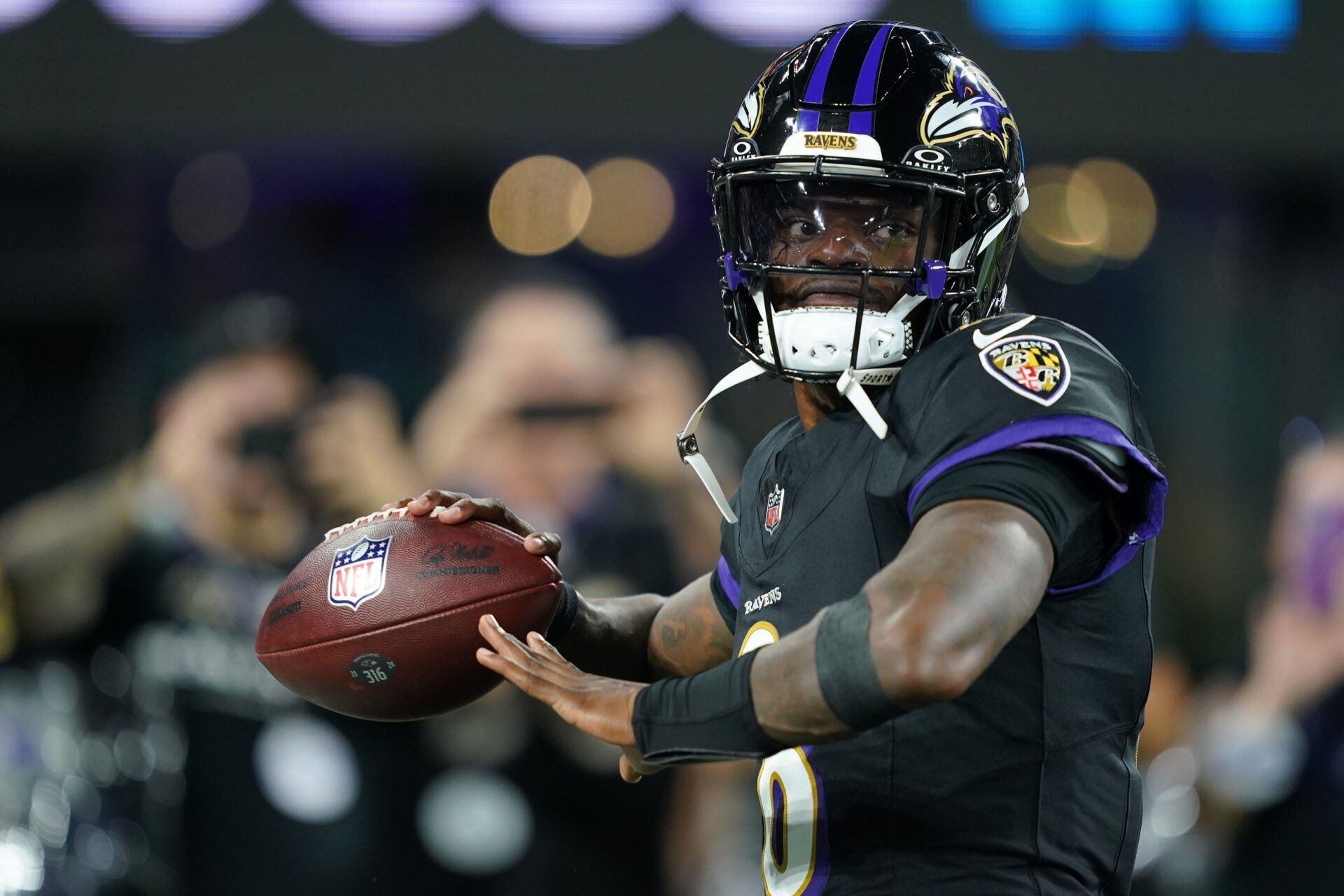 Baltimore Ravens quarterback Lamar Jackson (8) practices before the game against the Detroit Lions at M&T Bank Stadium.