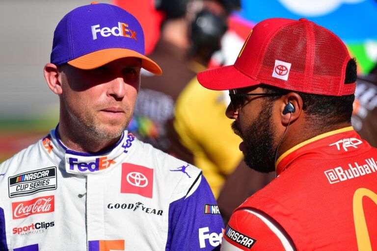 NASCAR Cup Series driver Denny Hamlin (11) speaks with driver Bubba Wallace (45) during practice at Las Vegas Motor Speedway.