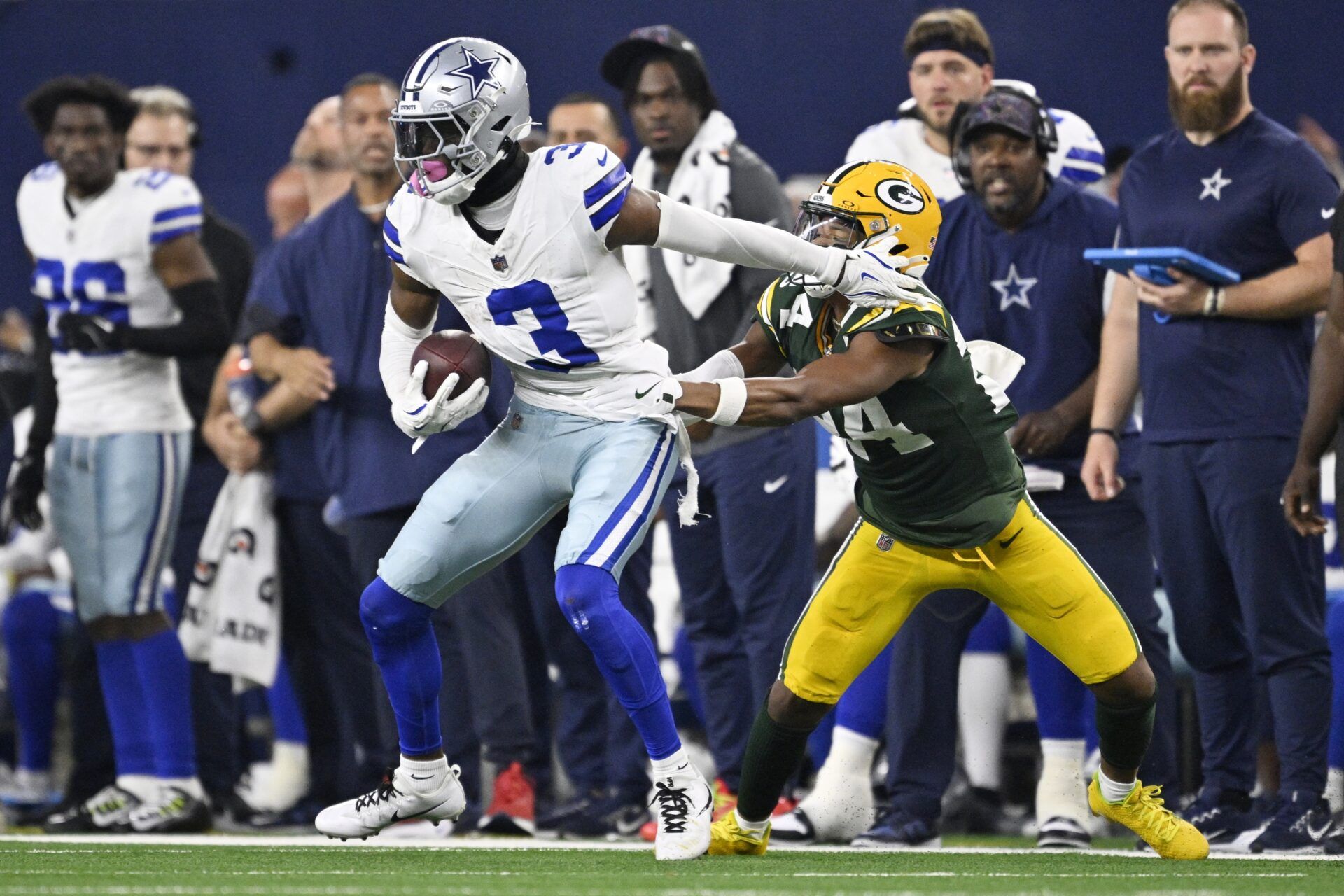 Dallas Cowboys wide receiver George Pickens (3) catches a pass against Green Bay Packers cornerback Carrington Valentine (24) in overtime at AT&T Stadium.