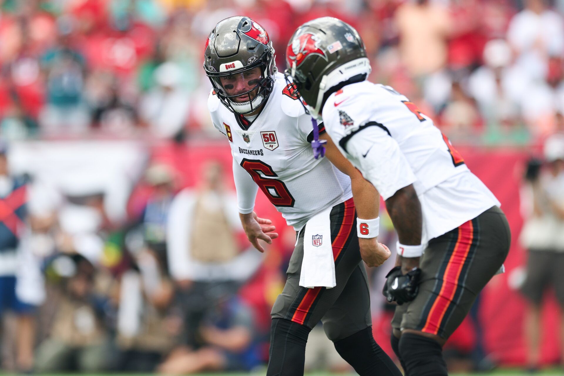 Tampa Bay Buccaneers quarterback Baker Mayfield (6) communicates with running back Bucky Irving (7) during the first quarter against the Philadelphia Eagles at Raymond James Stadium.