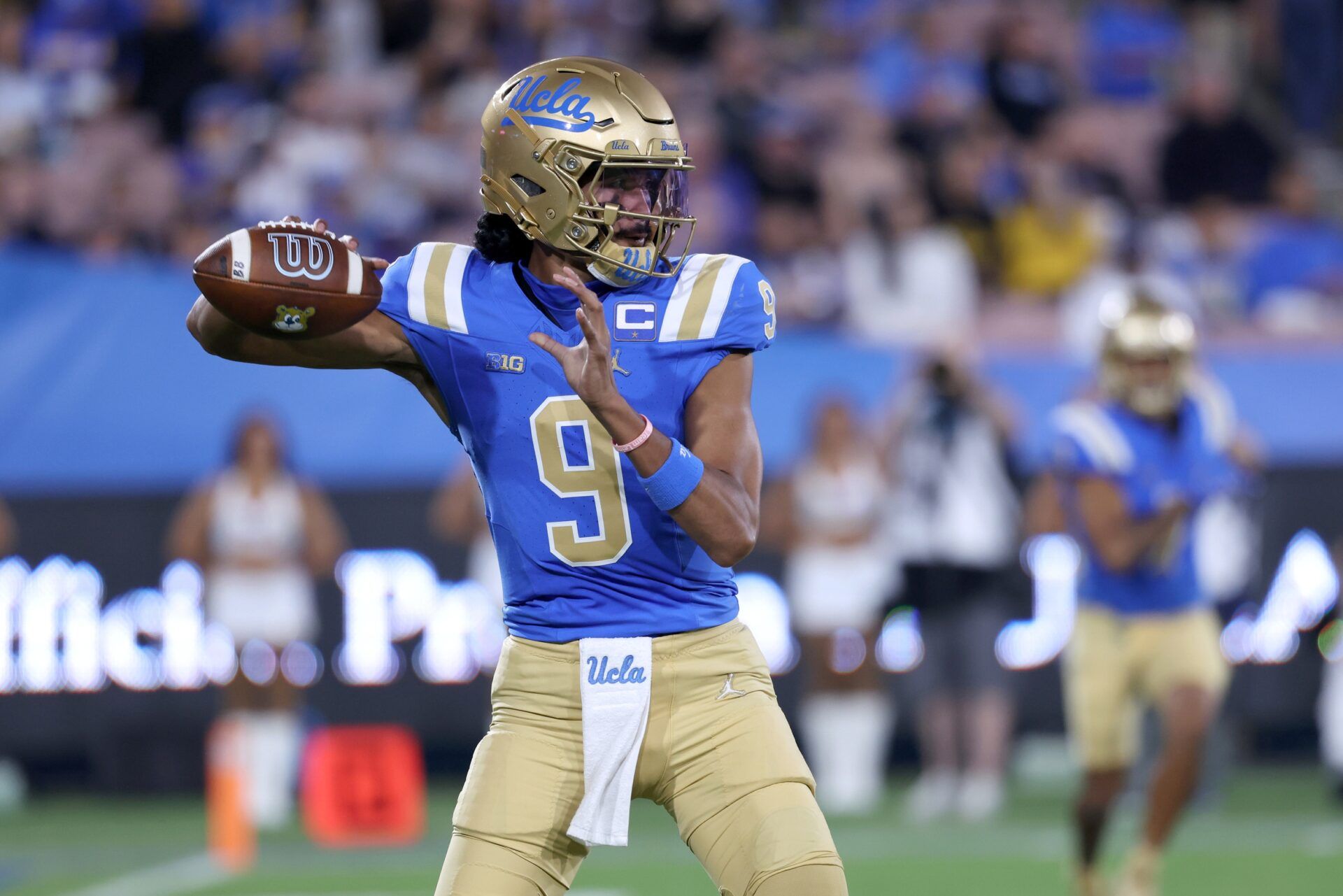 UCLA Bruins quarterback Nico Iamaleava (9) looks to pass during the first quarter against the New Mexico Lobos at Rose Bowl.
