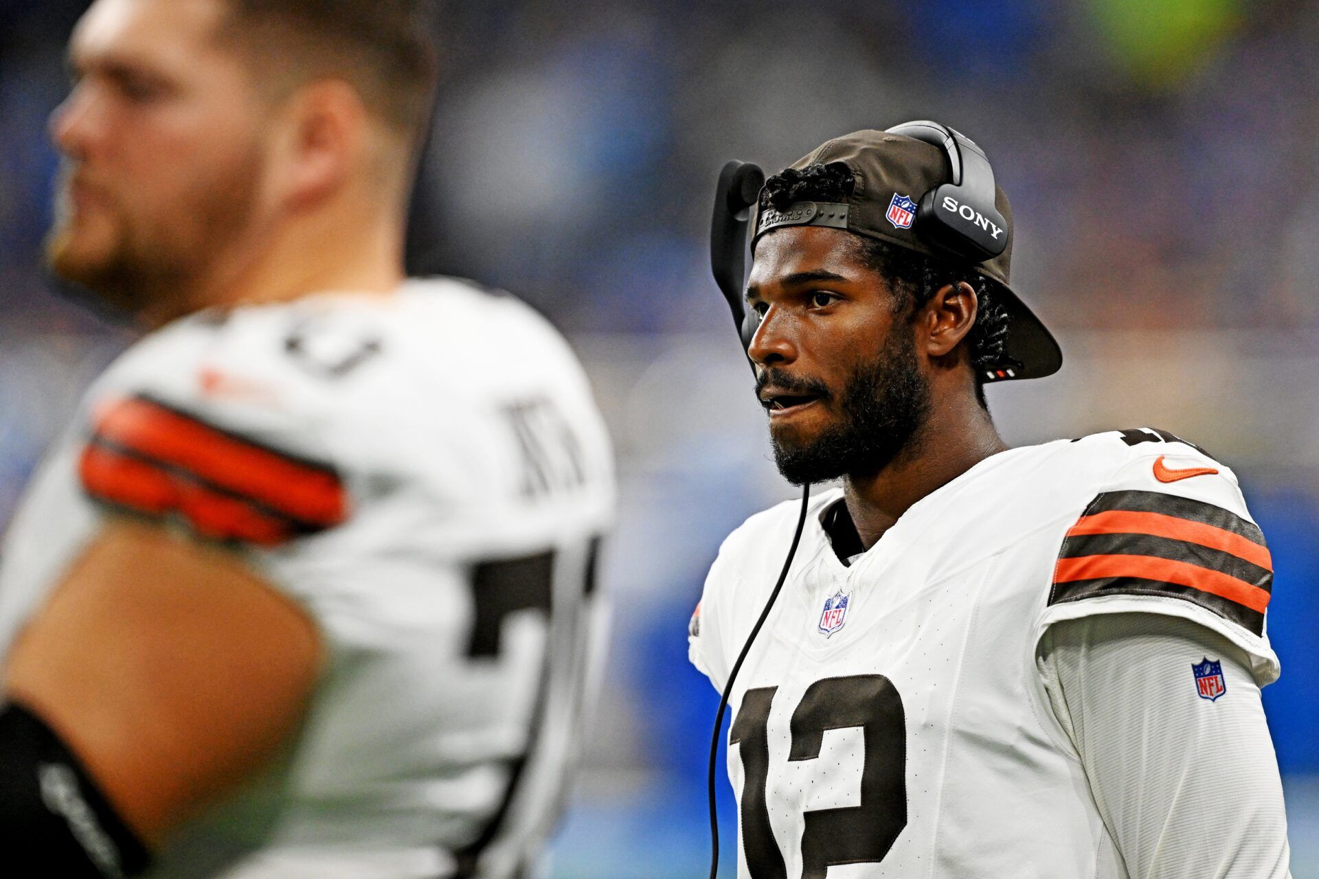 Cleveland Browns quarterback Shedeur Sanders (12) looks on from he sidelines during the second half against the Detroit Lions at Ford Field.
