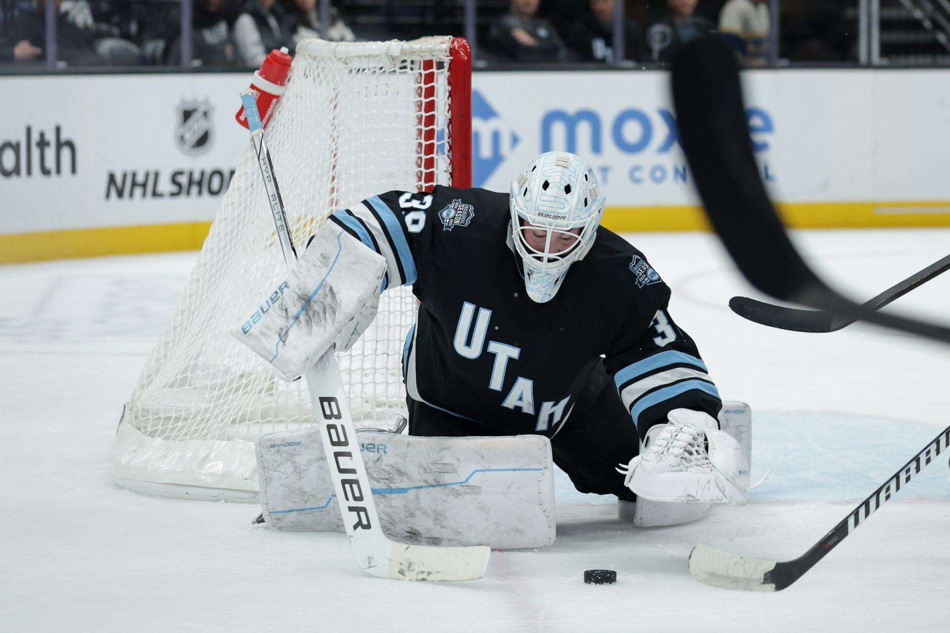 Utah Hockey Club goaltender Connor Ingram (39) jumps on a loose puck during the first period against the St. Louis Blues at Delta Center.