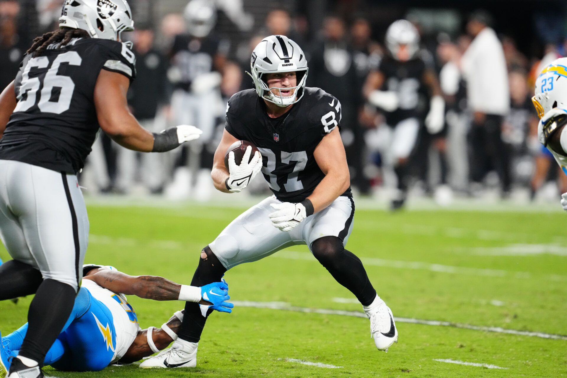 Las Vegas Raiders tight end Michael Mayer (87) rushes during the second quarter against the Los Angeles Chargers at Allegiant Stadium.