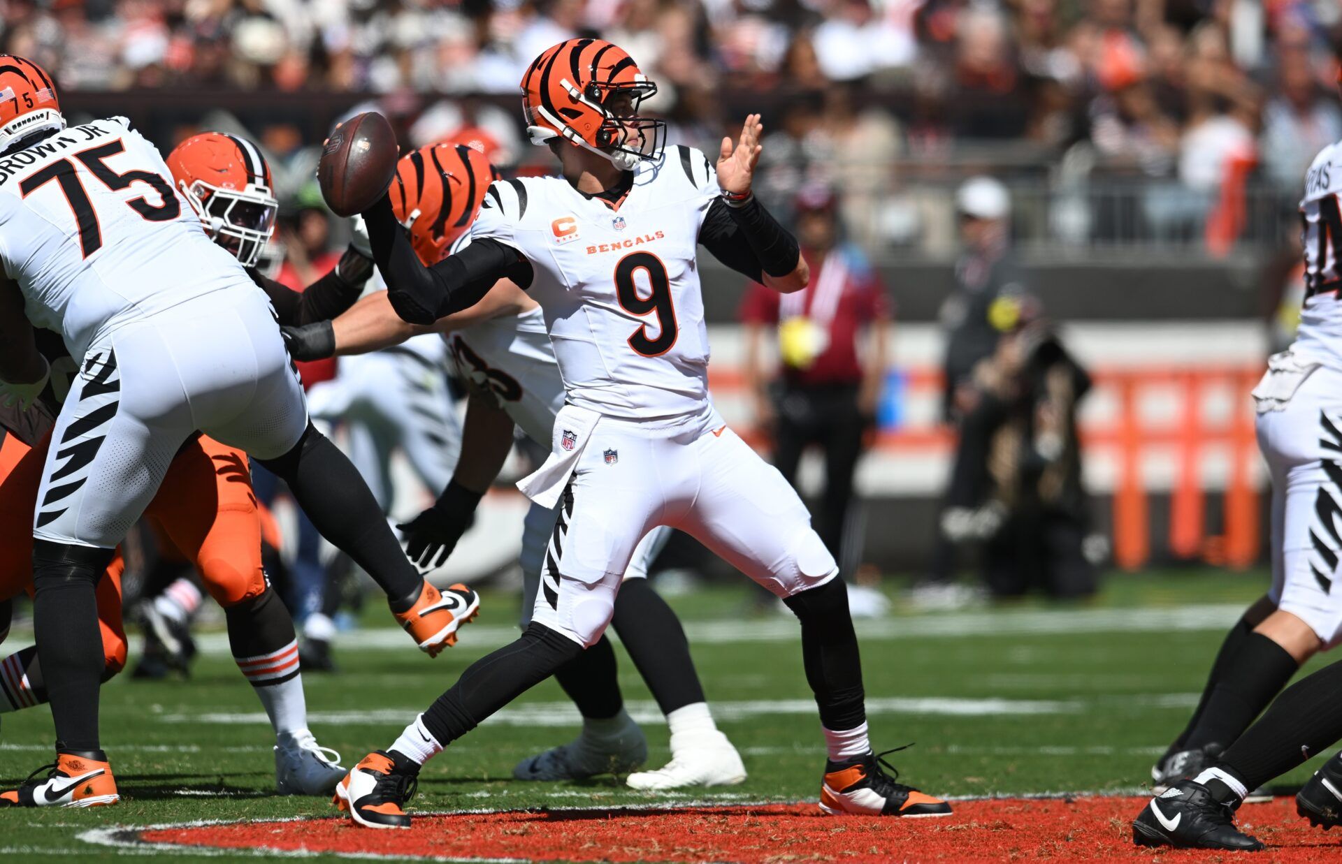 Cincinnati Bengals quarterback Joe Burrow (9) throws during the first half against the Cleveland Browns at Huntington Bank Field.