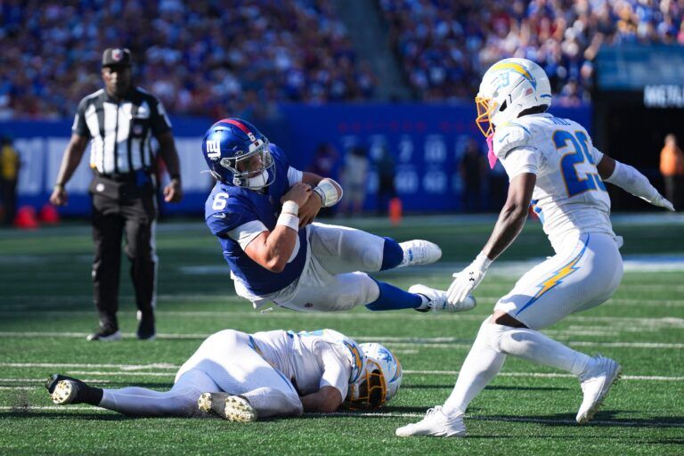 New York Giants quarterback Jaxson Dart (6) falls during a game against the Los Angeles Chargers at MetLife Stadium, Sep 28, 2025, East Rutherford, NJ, USA.