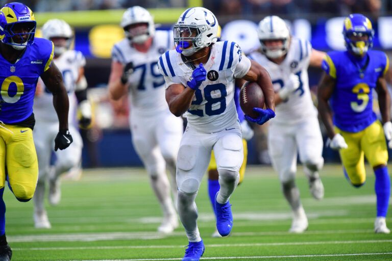 Indianapolis Colts running back Jonathan Taylor (28) runs the ball against the Los Angeles Rams during the second half at SoFi Stadium.