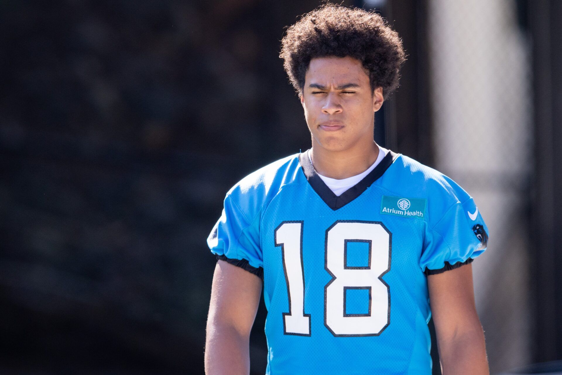 Carolina Panthers wide receiver Jalen Coker (18) walks out for training camp.