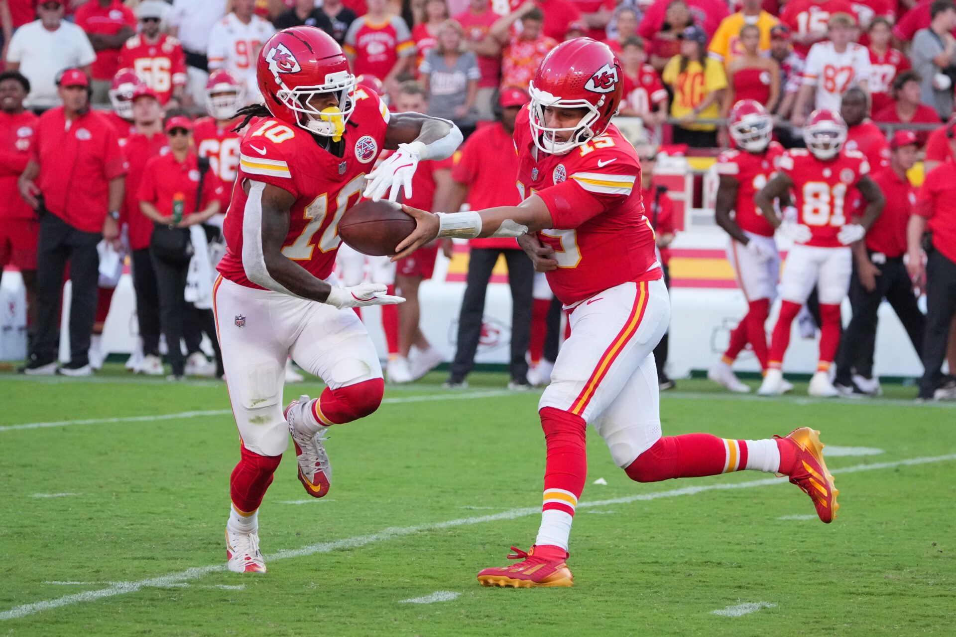 Kansas City Chiefs quarterback Patrick Mahomes (15) hands the ball off to Kansas City Chiefs running back Isiah Pacheco (10) during the fourth quarter against the Baltimore Ravens at GEHA Field at Arrowhead Stadium.