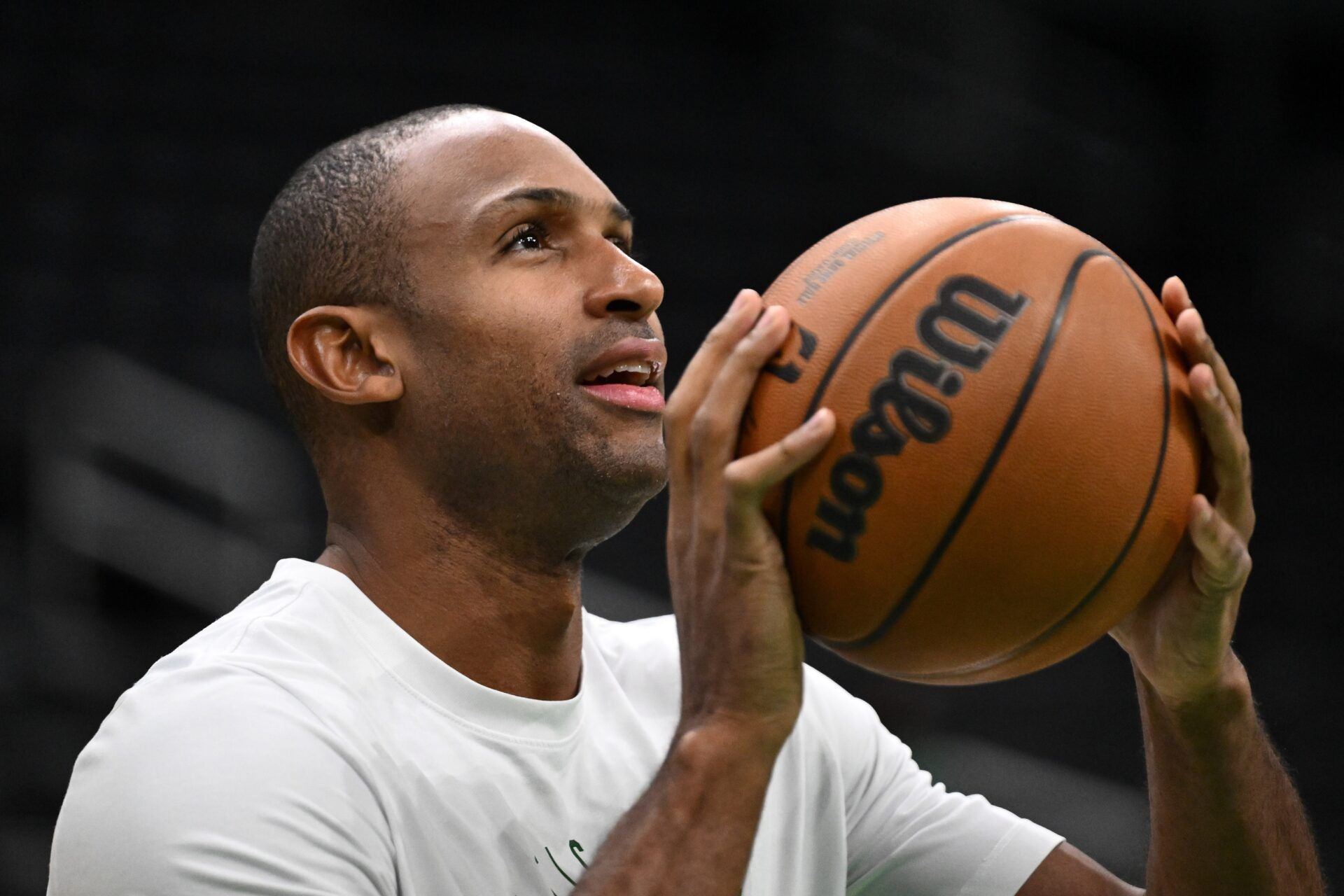 Boston Celtics center Al Horford (42) takes a shot during warmups before a game against the Detroit Pistons at the TD Garden.