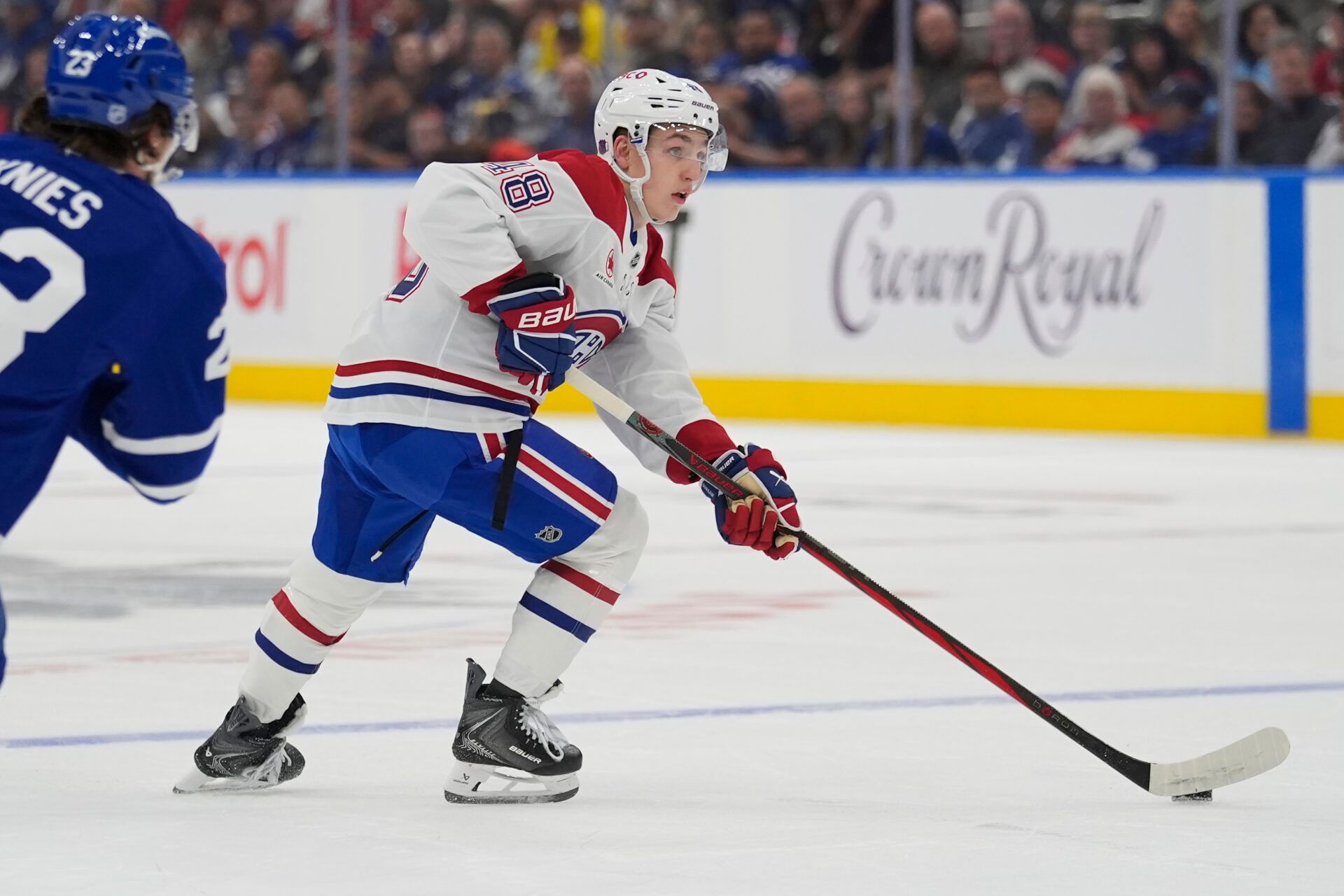 defenseman Lane Hutson (48) carries the puck against the Toronto Maple Leafs during the second period at Scotiabank Arena.