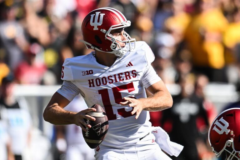 Indiana Hoosiers quarterback Fernando Mendoza (15) throws a pass against the Iowa Hawkeyes during the second quarter at Kinnick Stadium.