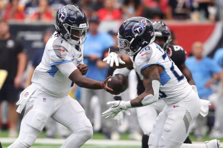 Tennessee Titans quarterback Cam Ward (1) hands off to running back Tony Pollard (20) during the third quarter against the Houston Texans at NRG Stadium.