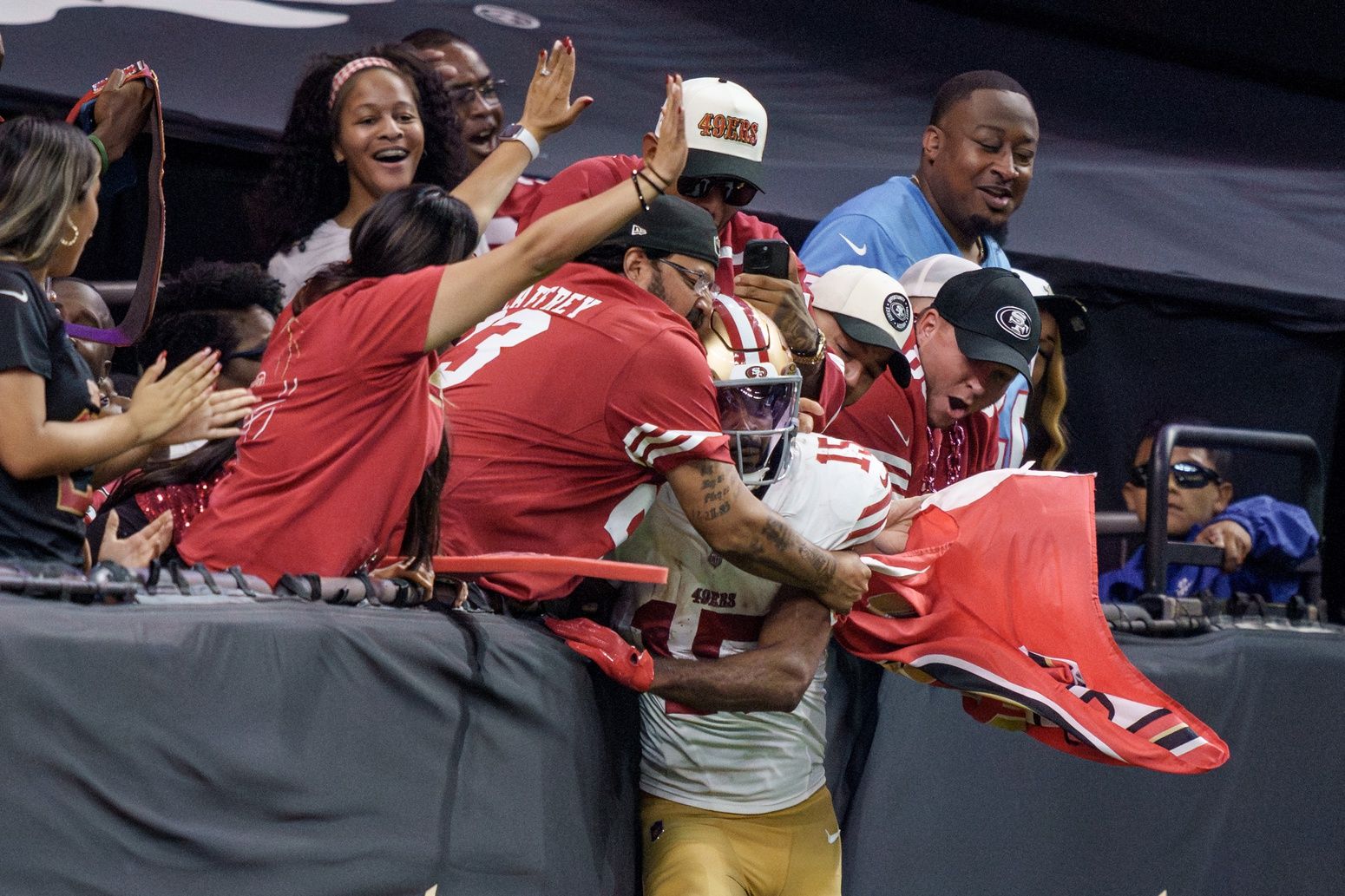 San Francisco 49ers wide receiver Jauan Jennings (15) leaps into the arms of fans after scoring a touchdown against the New Orleans Saints during the fourth quarter at Caesars Superdome.