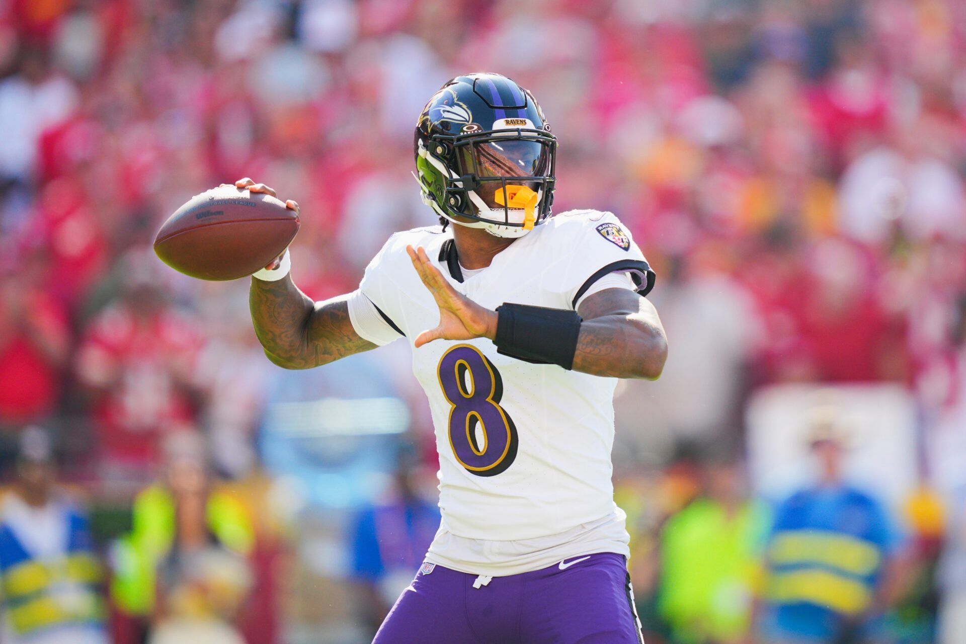 Baltimore Ravens quarterback Lamar Jackson (8) throws a pass during the first half against the Kansas City Chiefs at GEHA Field at Arrowhead Stadium.