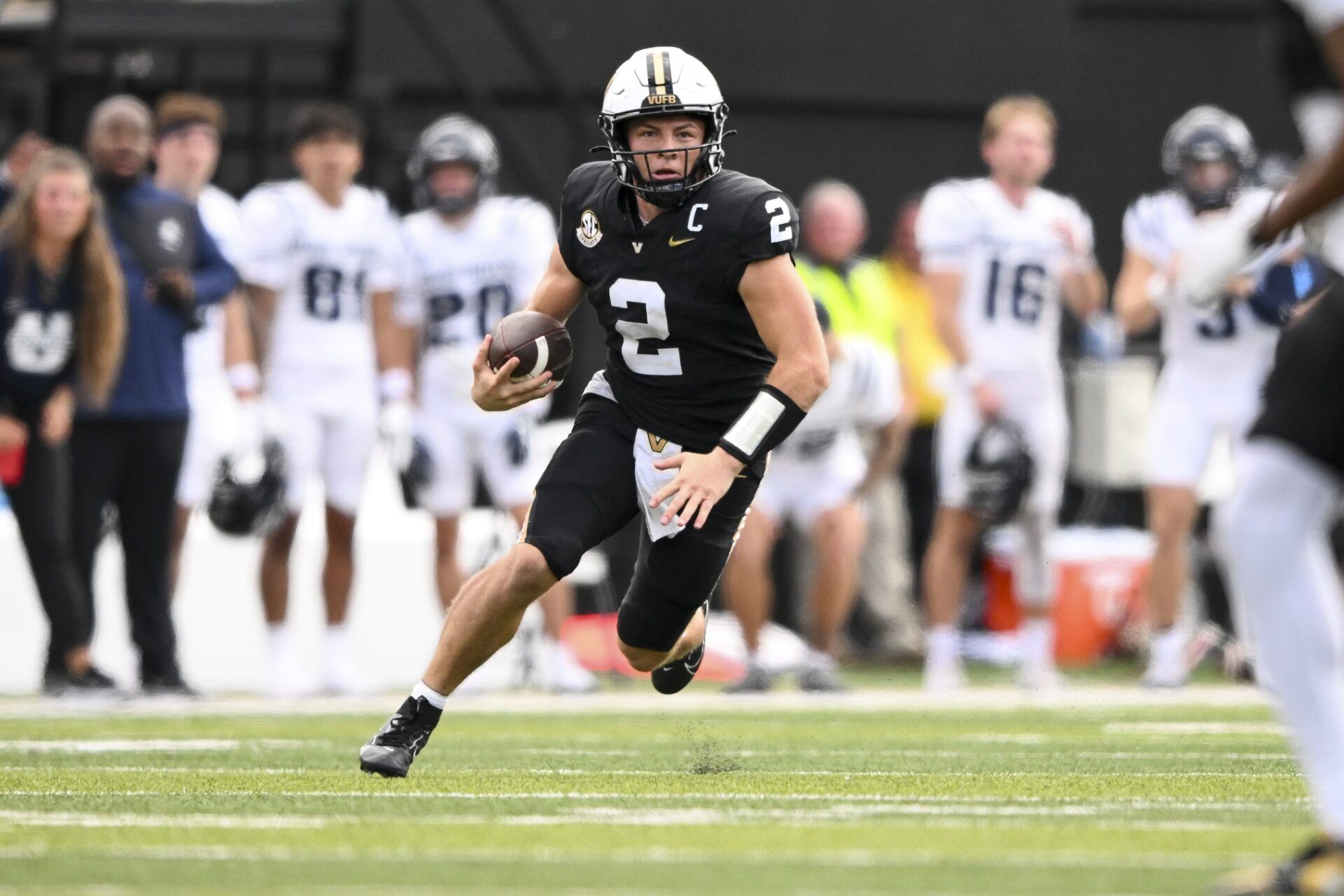 Vanderbilt Commodores quarterback Diego Pavia (2) runs with the ball against the Utah State Aggies during the second half at FirstBank Stadium.