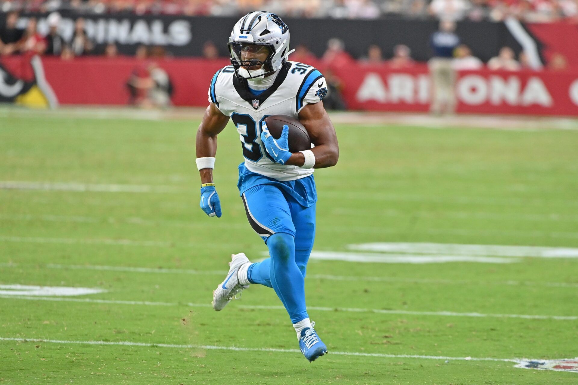 Carolina Panthers running back Chuba Hubbard (30) runs with the ball during the fourth quarter against the Arizona Cardinals at State Farm Stadium.