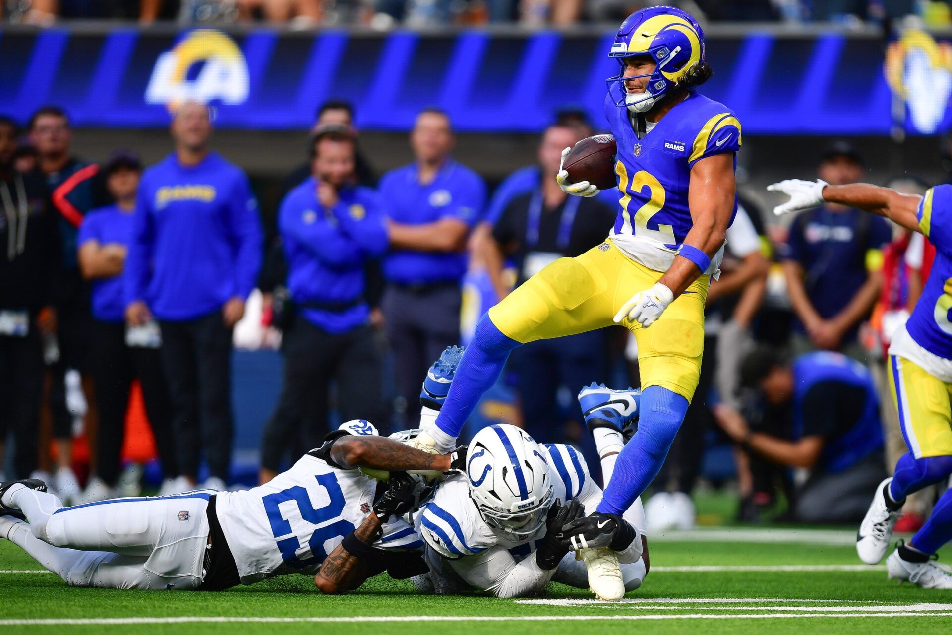 Los Angeles Rams wide receiver Puka Nacua (12) is brought down by Indianapolis Colts safety Rodney Thomas (25) during the second half at SoFi Stadium.
