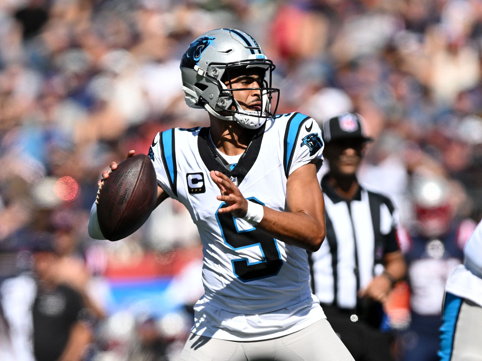 Carolina Panthers quarterback Bryce Young (9) looks to throw against the New England Patriots during the first half at Gillette Stadium.