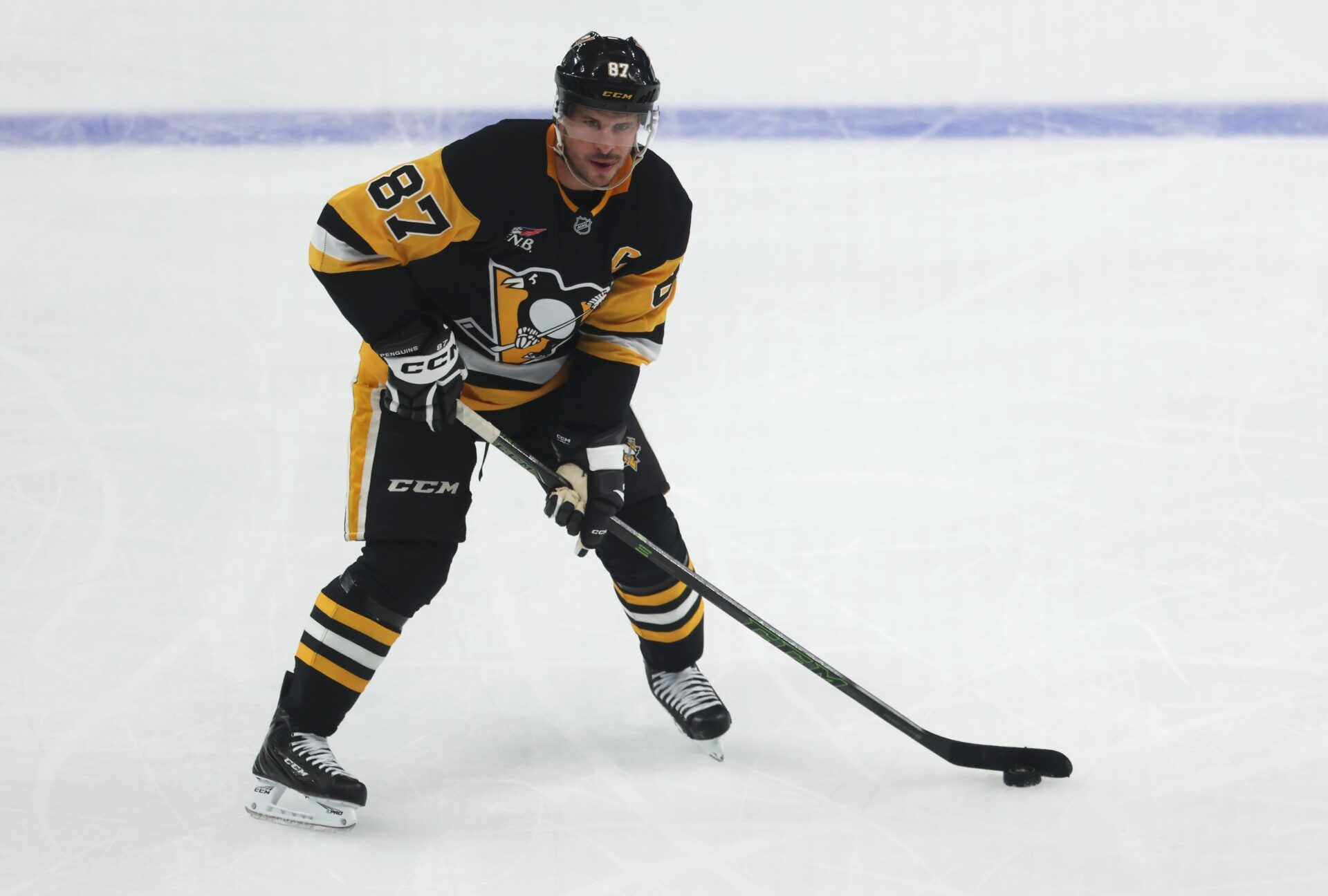 Pittsburgh Penguins center Sidney Crosby (87) skates with the puck against the Columbus Blue Jackets during the second period at PPG Paints Arena.