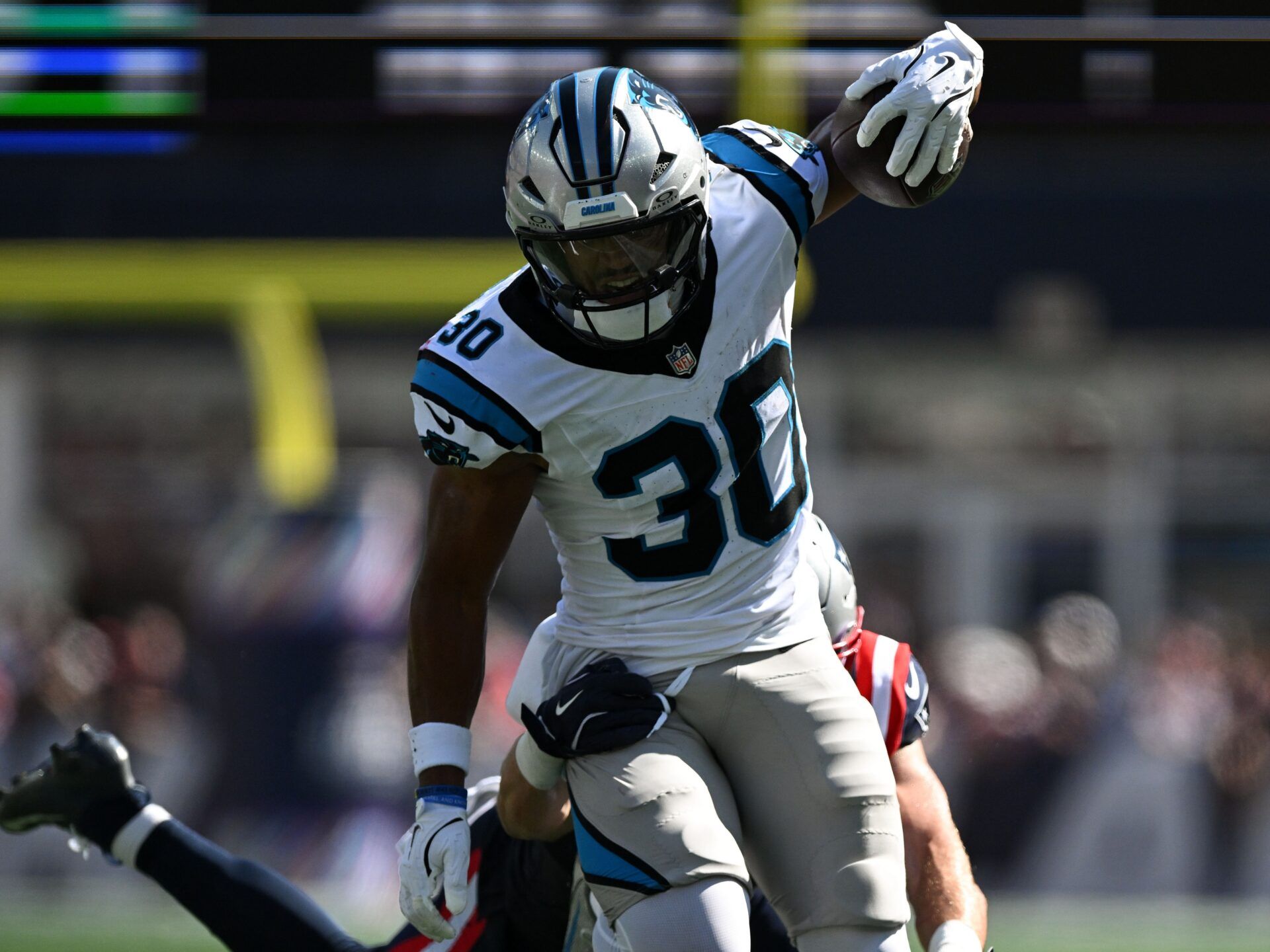 Carolina Panthers running back Chuba Hubbard (30) runs against the New England Patriots during the first half at Gillette Stadium.