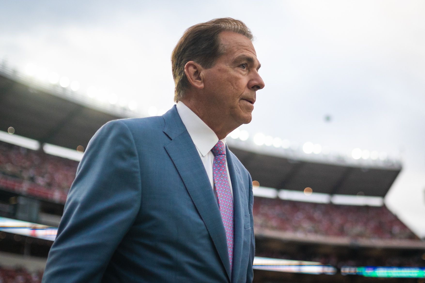 Former Alabama Crimson Tide head coach Nick Saban walks onto the field before a game between the Crimson Tide and Georgia Bulldogs at Bryant-Denny Stadium.