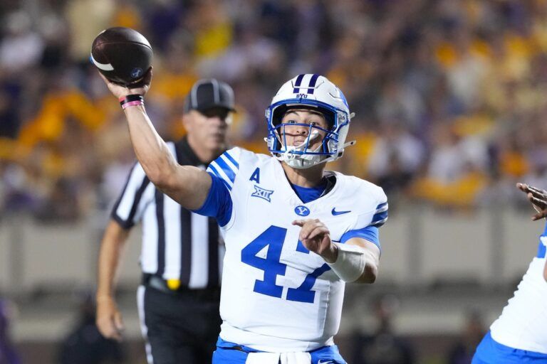 Brigham Young Cougars quarterback Bear Bachmeier (47) throws the ball against the East Carolina Pirates during the second half at Dowdy-Ficklen Stadium.