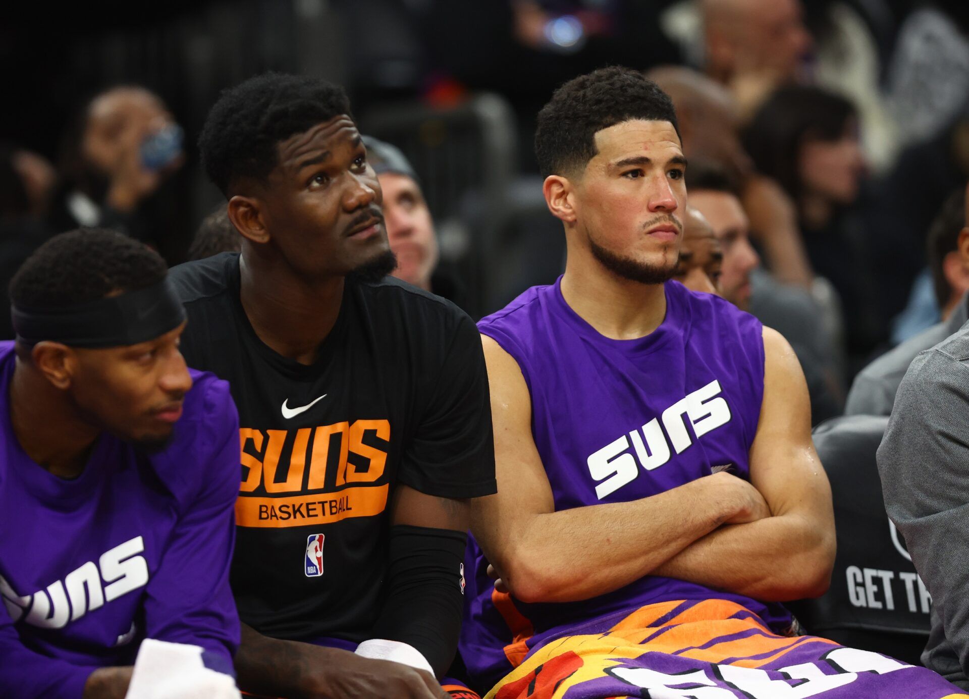 Phoenix Suns center Deandre Ayton (left) and guard Devin Booker react on the bench against the Boston Celtics in the second half at Footprint Center.