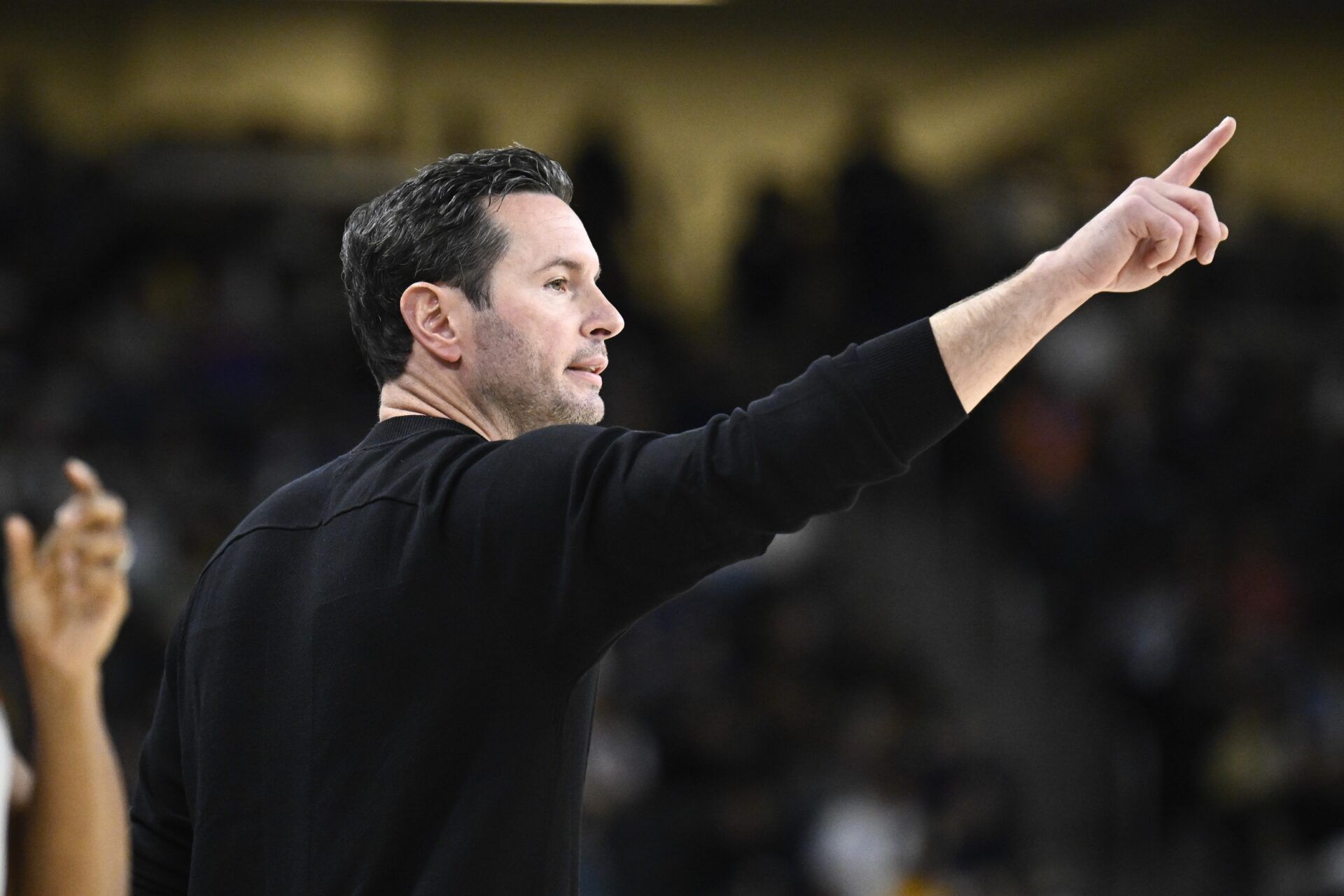 Los Angeles Lakers head coach JJ Redick gestures during the first half against the Phoenix Suns at Acrisure Arena.