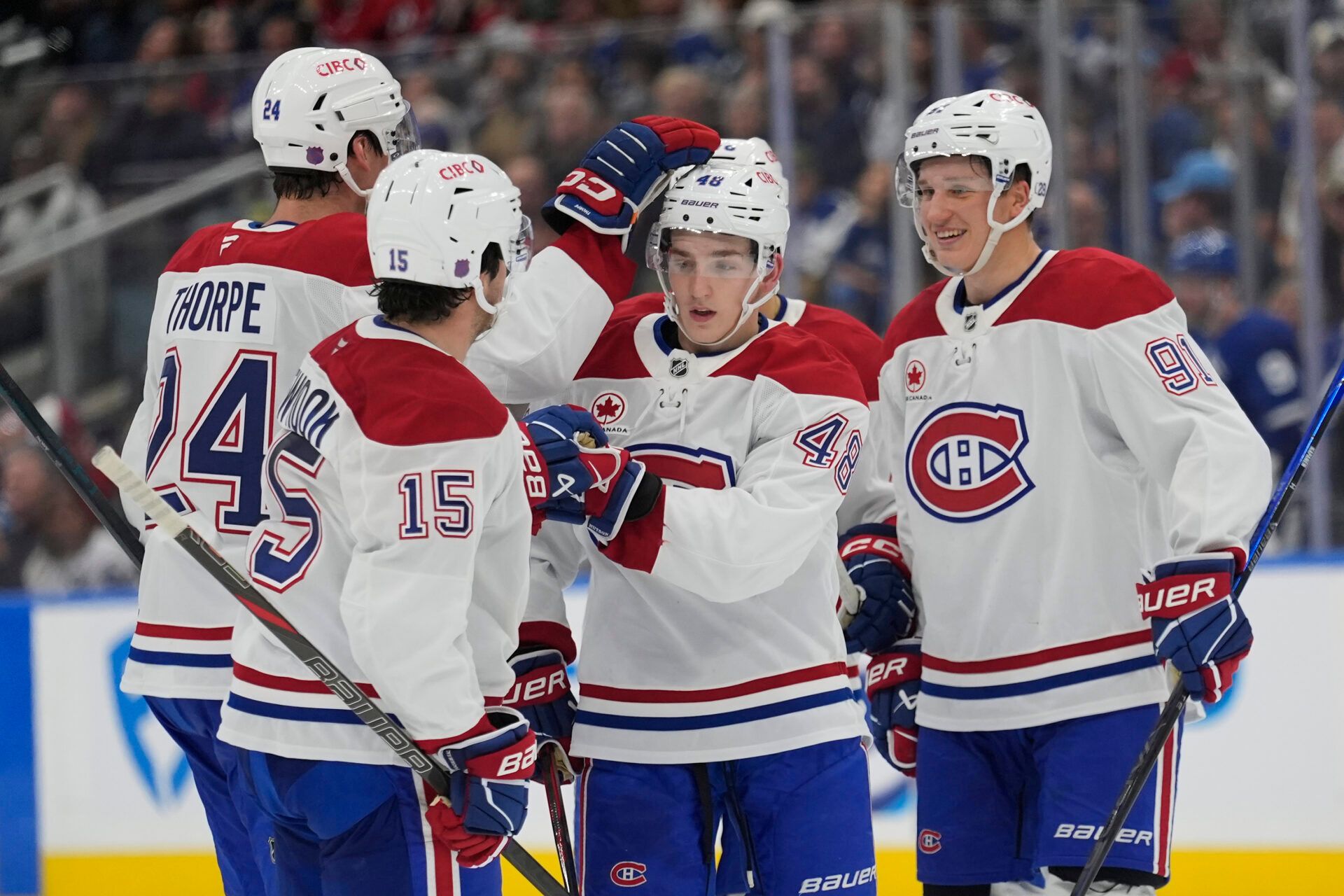 Montreal Canadiens defenseman Lane Hutson (48) get congratulated after his goal against the Toronto Maple Leafs during the second period at Scotiabank Arena.