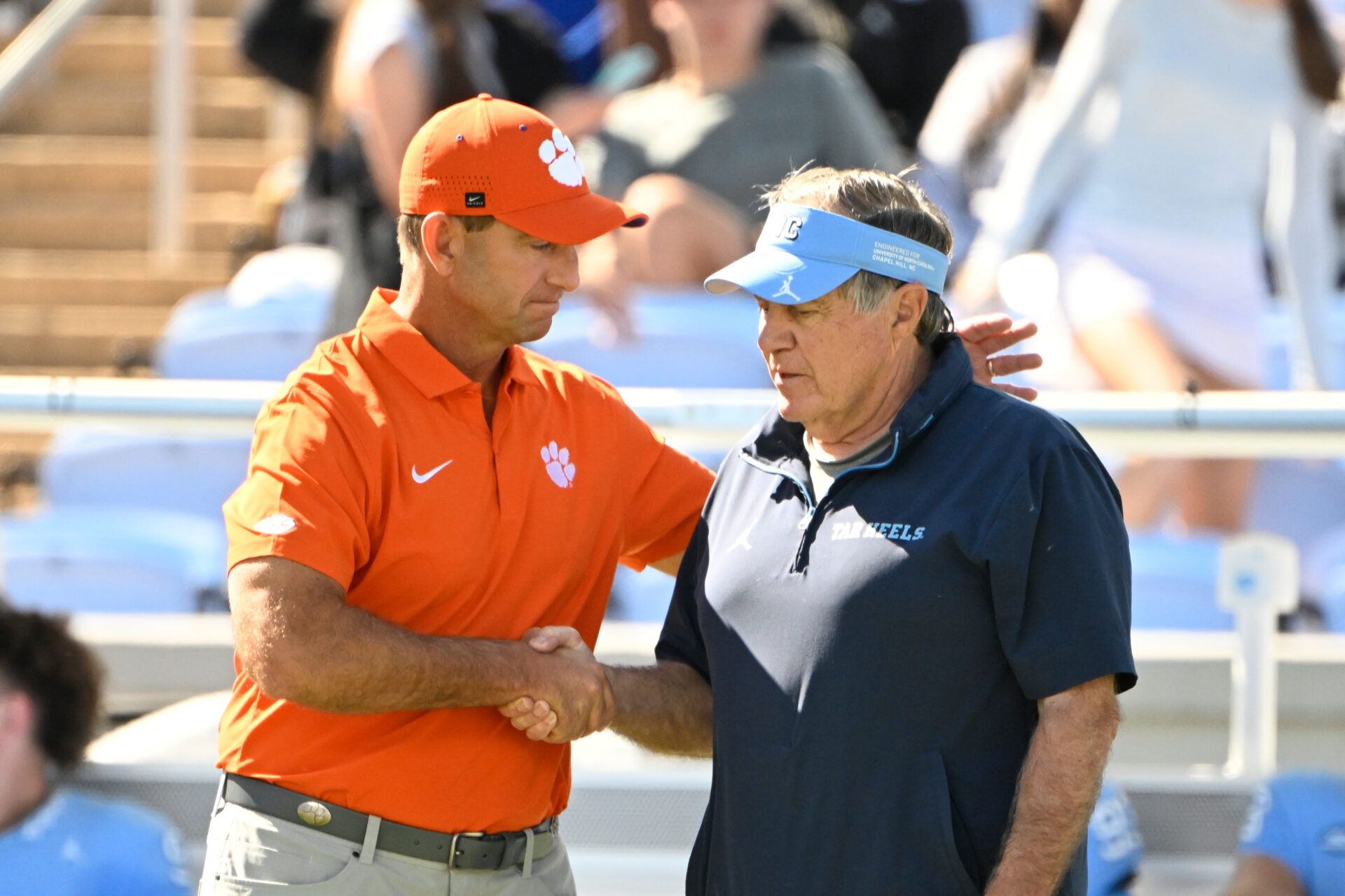 Clemson Tigers head coach Dabo Swinney with North Carolina Tar Heels head coach Bill Belichick before the game at Kenan Stadium.