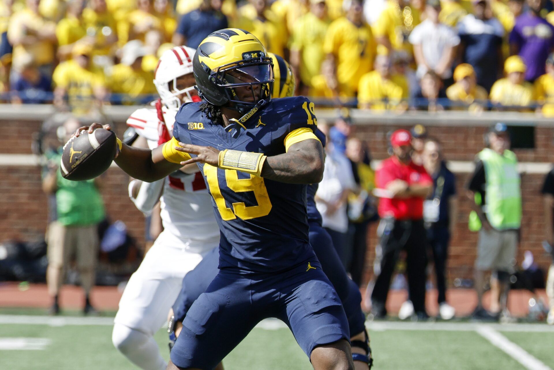 Michigan Wolverines quarterback Bryce Underwood (19) passes in the first half against the Wisconsin Badgers at Michigan Stadium.