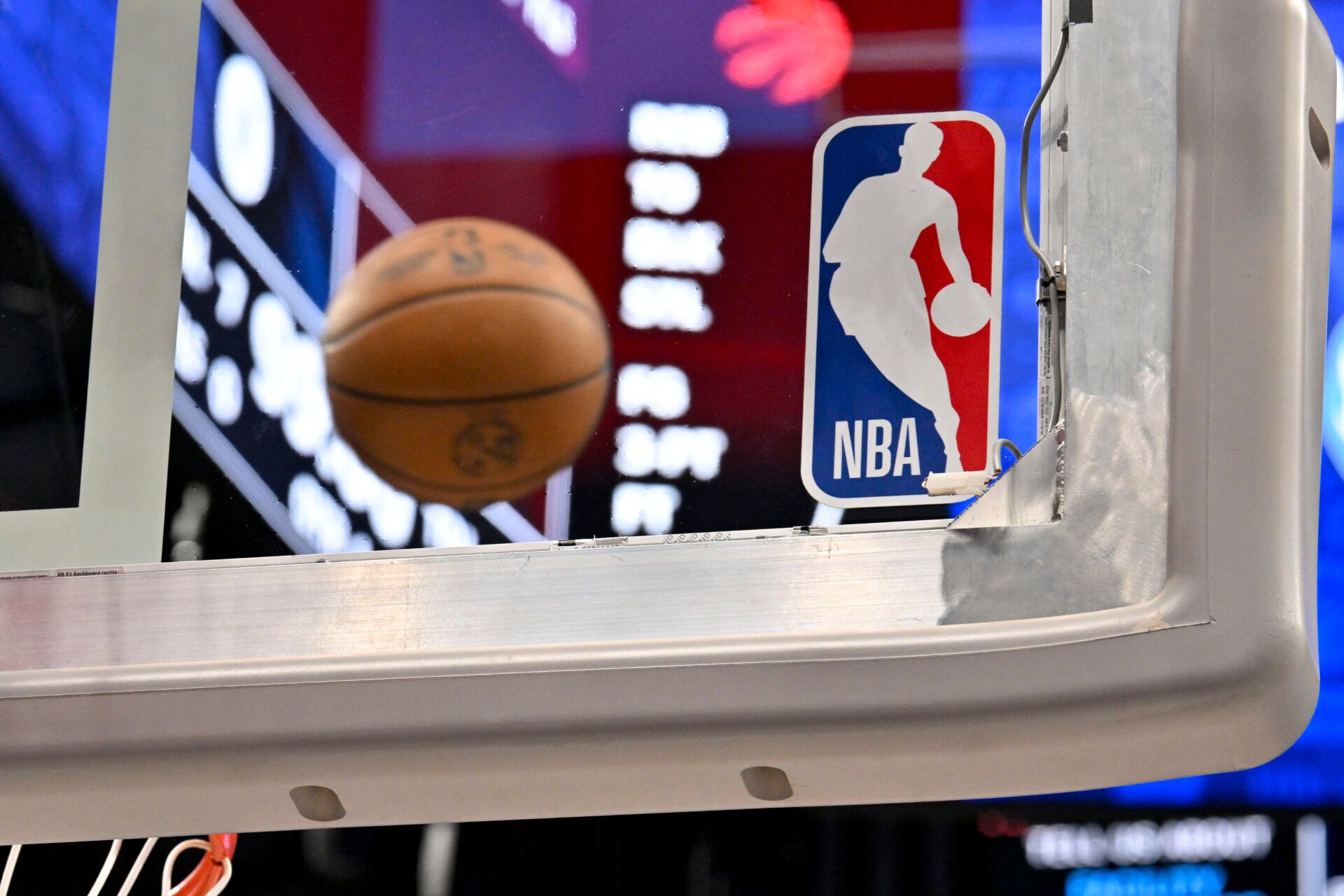 A view of an NBA basketball and backyard and NBA logo before the game between the Dallas Mavericks and the Toronto Raptors at the American Airlines Center.