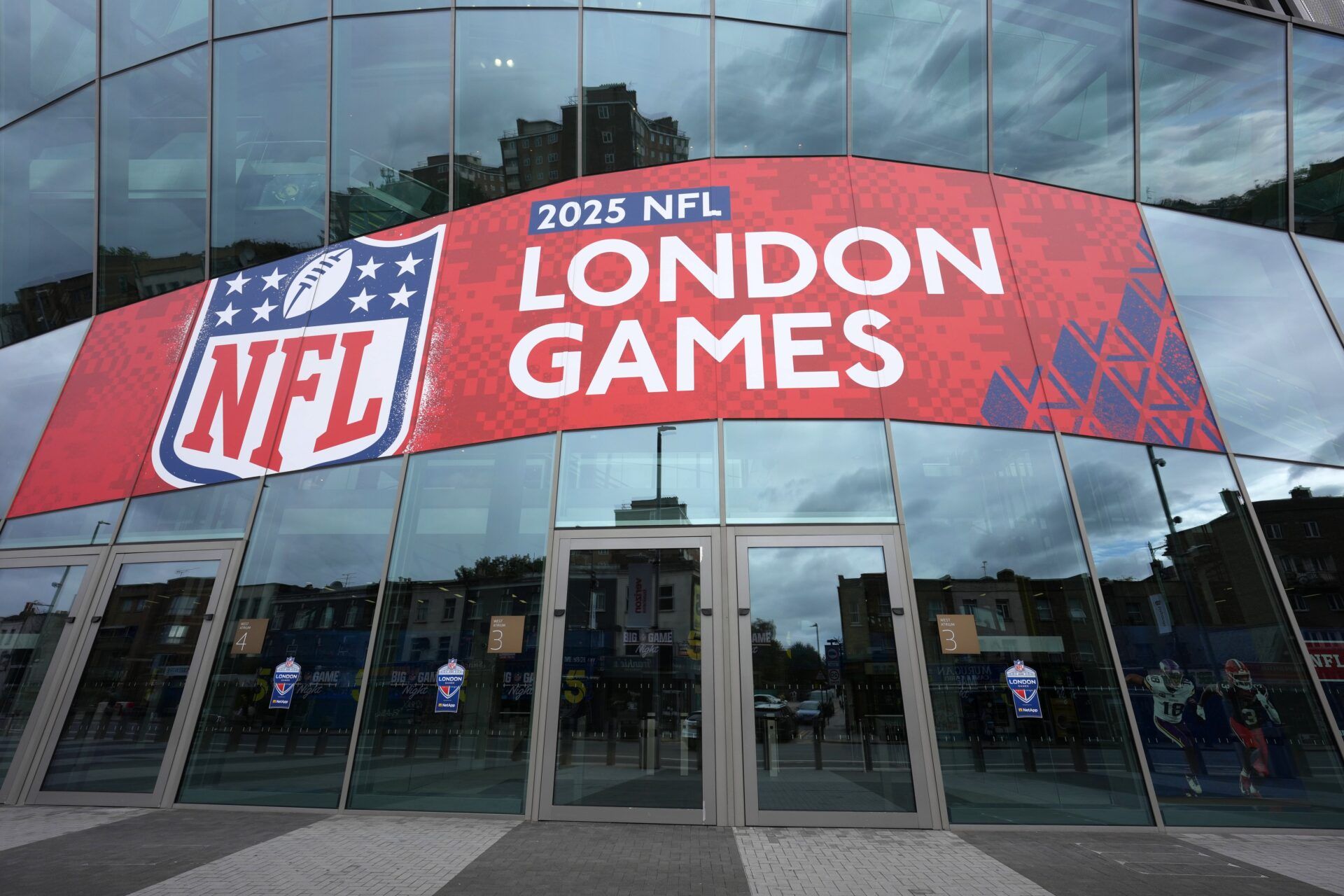 A general overall view as a red double decker bus passes by Tottenham Hotspur Stadium. The stadium is the site of the 2025 NFL London Games between the Minnesota Vikings and the Cleveland Browns and Denver Broncos and the New York Jets.