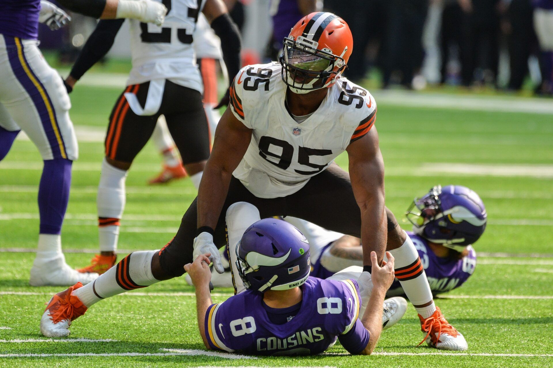 Cleveland Browns defensive end Myles Garrett (95) wraps up Minnesota Vikings quarterback Kirk Cousins (8) during the third quarter at U.S. Bank Stadium.