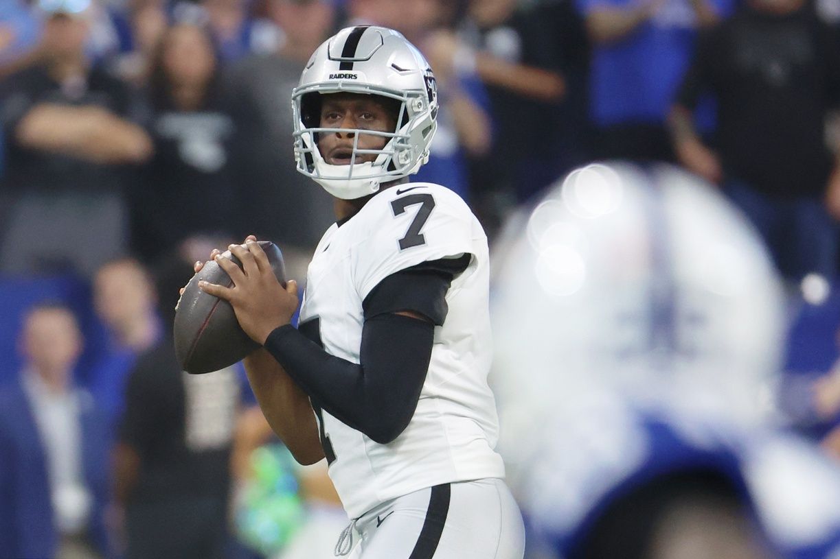 Las Vegas Raiders quarterback Geno Smith (7) looks to pass the ball against the Indianapolis Colts during the first quarter at Lucas Oil Stadium.