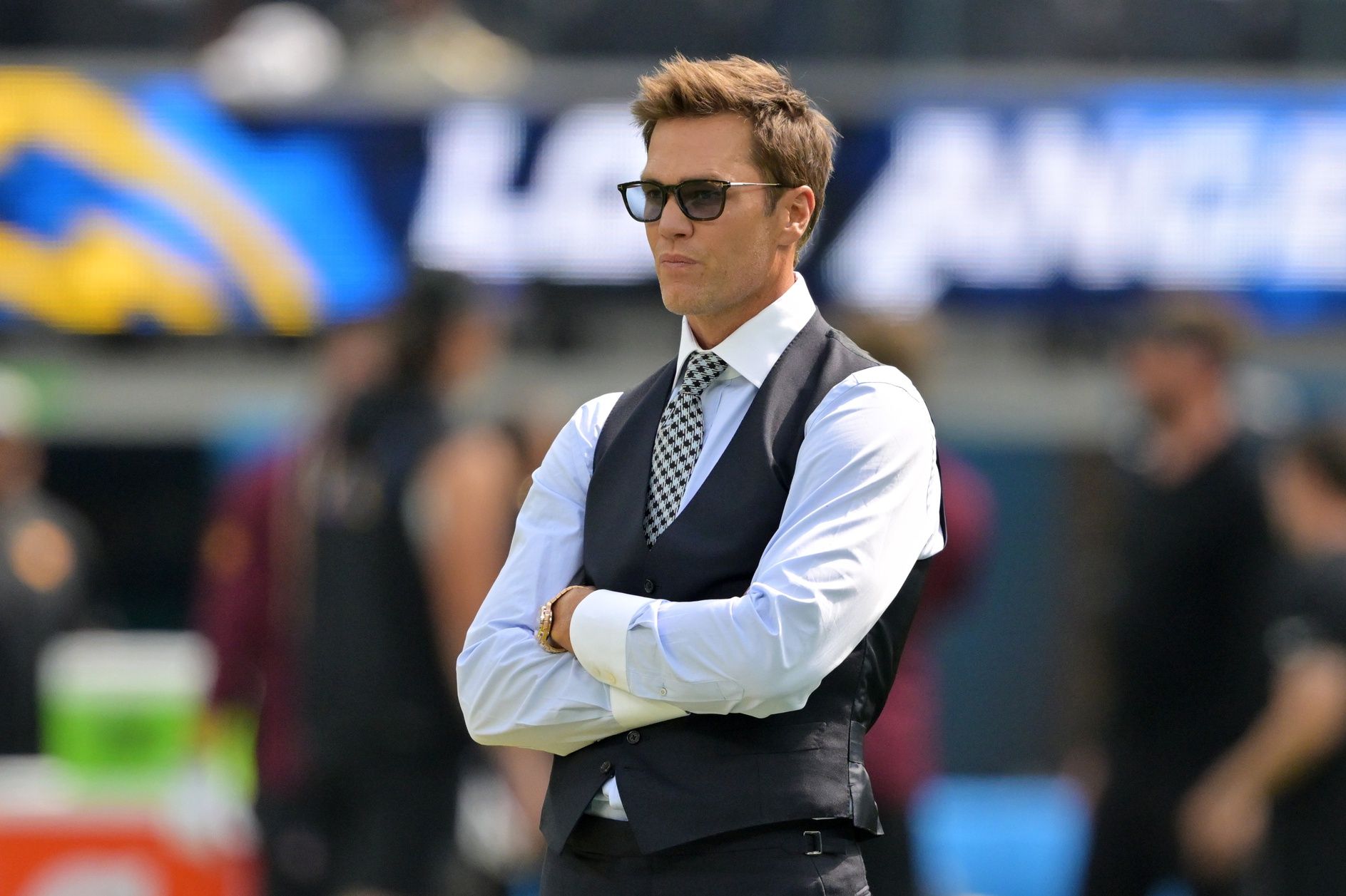 Tom Brady looks on before the game between the Los Angeles Chargers and the Washington Commanders at SoFi Stadium.