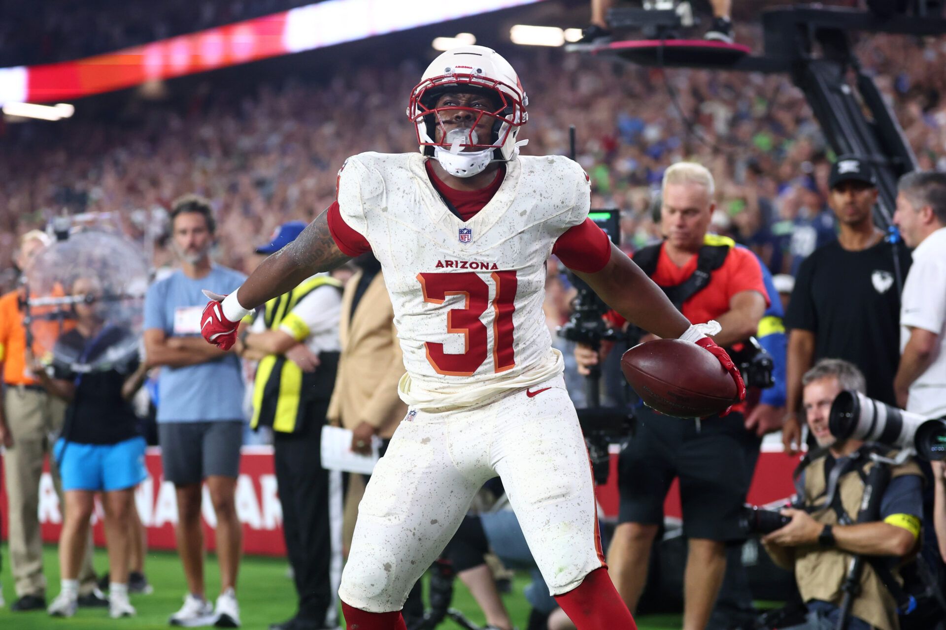 Arizona Cardinals running back Emari Demercado (31) celebrates scoring a touchdown against the Seattle Seahawks in the fourth quarter at State Farm Stadium.
