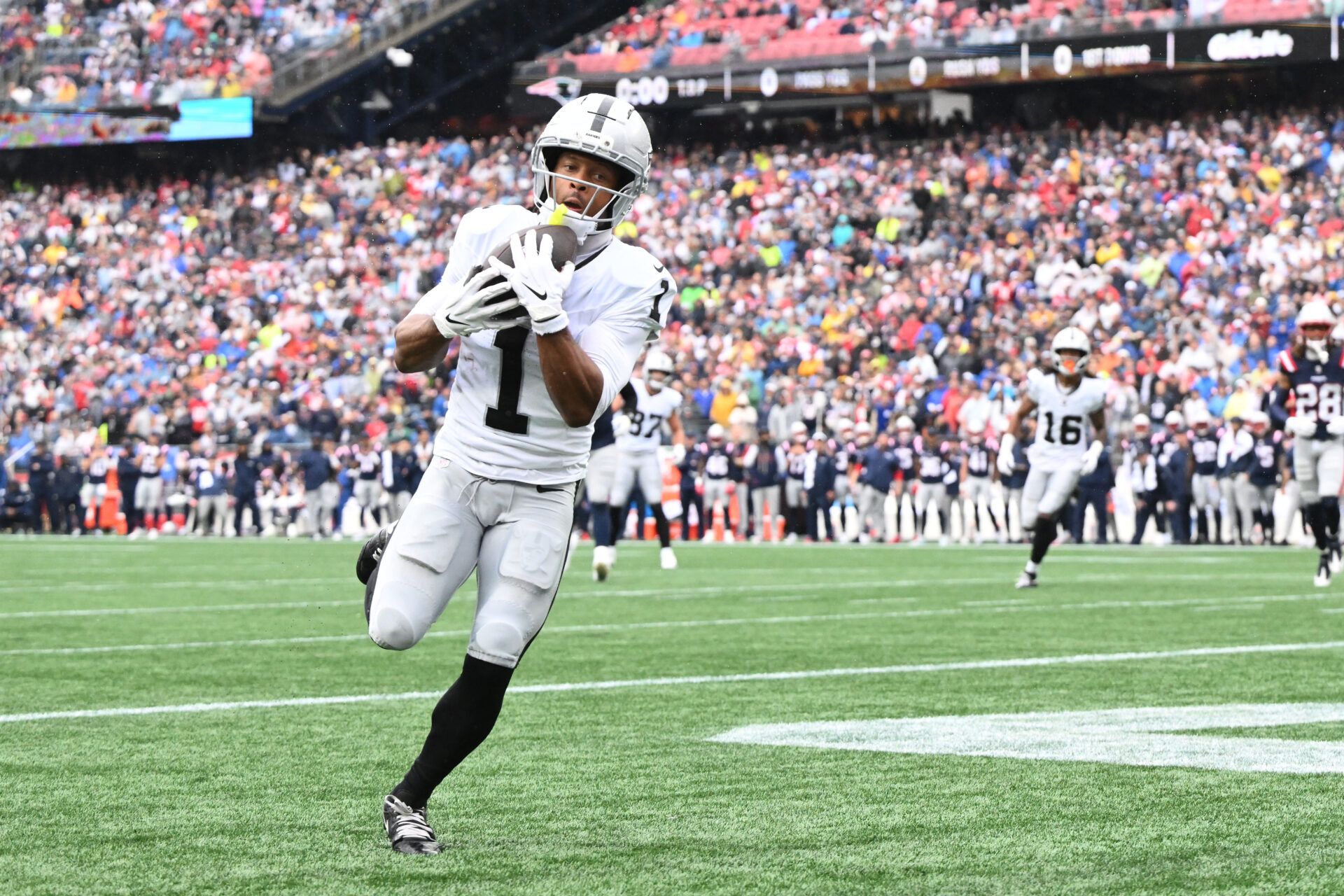 Las Vegas Raiders wide receiver Tre Tucker (1) makes a touchdown catch against the New England Patriots during the first half at Gillette Stadium.