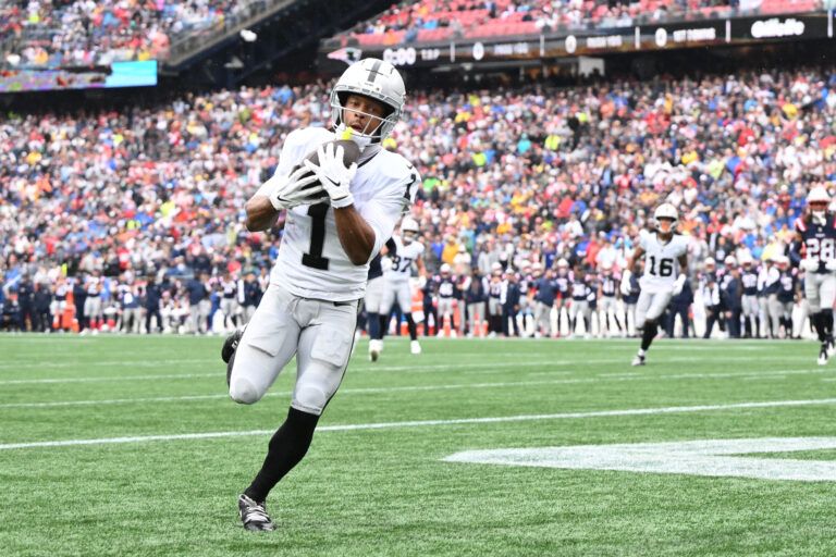Las Vegas Raiders wide receiver Tre Tucker (1) makes a touchdown catch against the New England Patriots during the first half at Gillette Stadium.