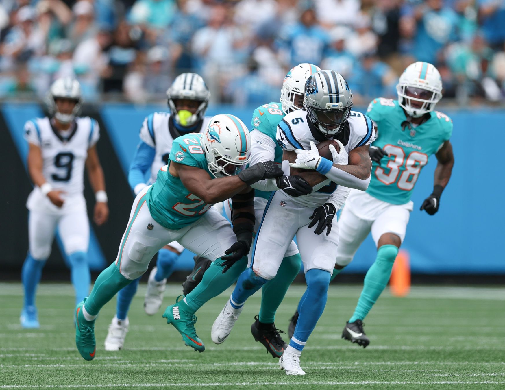 Carolina Panthers running back Rico Dowdle (5) carries the ball during the second quarter against the Miami Dolphins at Bank of America Stadium.