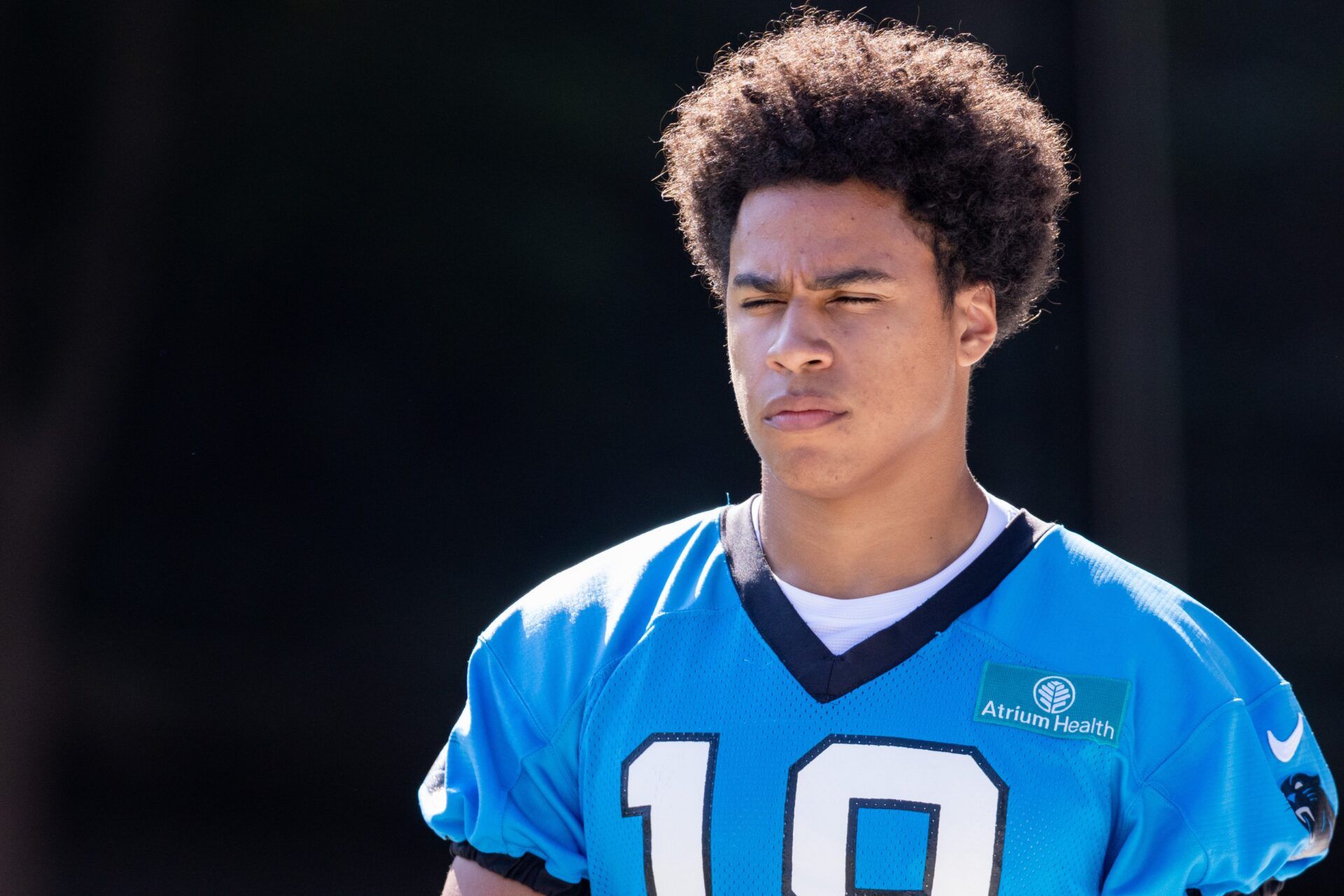 Carolina Panthers wide receiver Jalen Coker (18) walks out for training camp.