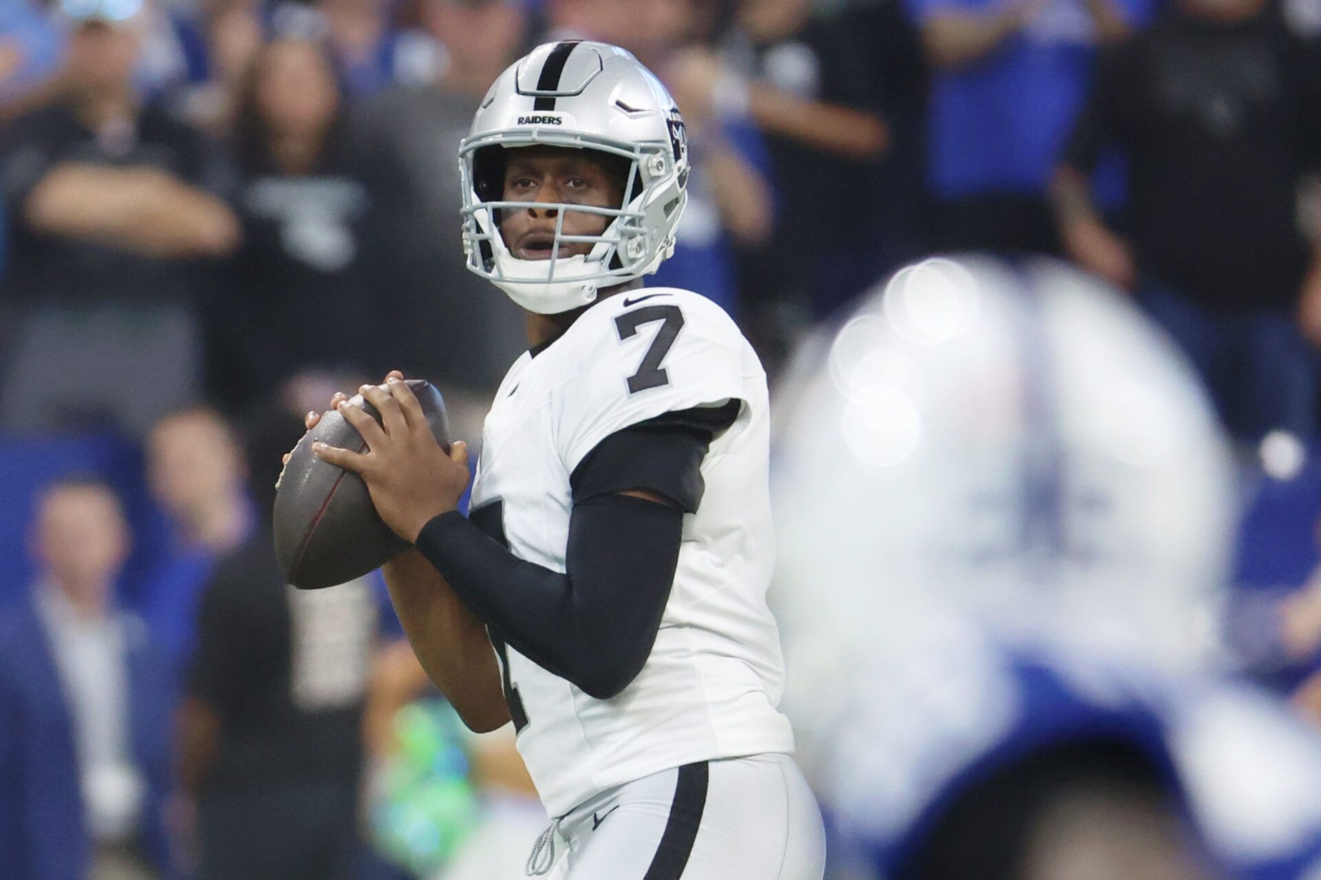 Las Vegas Raiders quarterback Geno Smith (7) looks to pass the ball against the Indianapolis Colts during the first quarter at Lucas Oil Stadium.