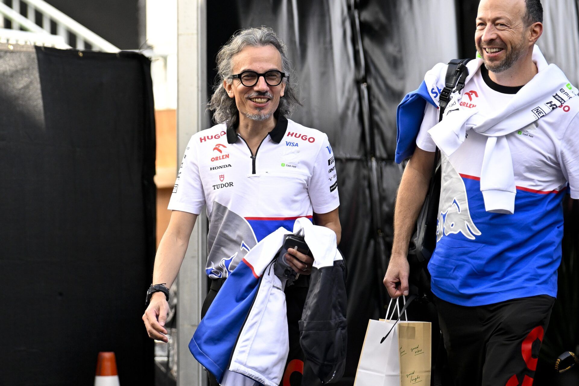 Visa Cash App RB Formula One Team engineer Laurent Mekies of Team France (left) walks through the track entrance before practice for the 2024 US Grand Prix at Circuit of the Americas.
