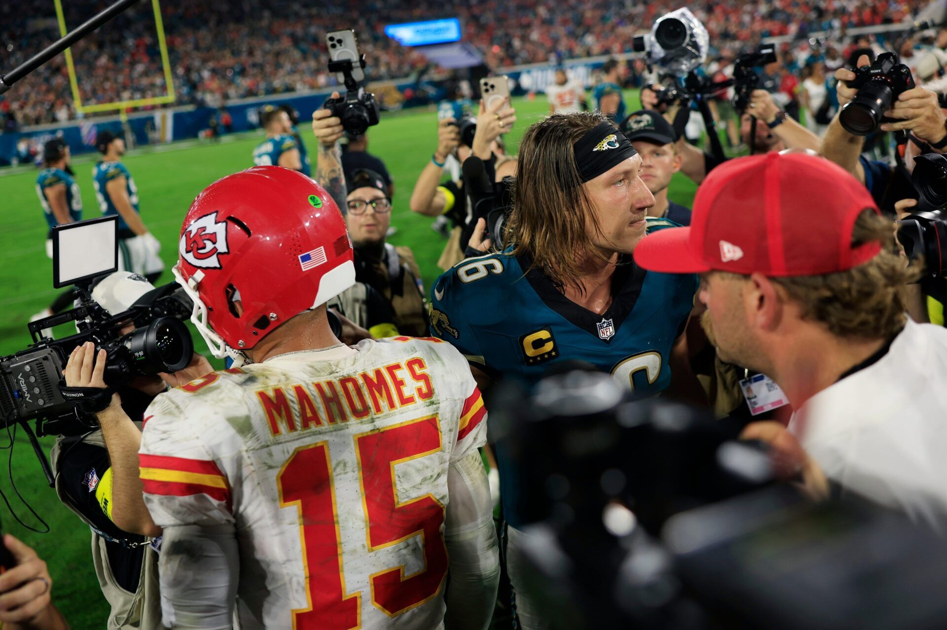 Jacksonville Jaguars quarterback Trevor Lawrence (16) and Kansas City Chiefs quarterback Patrick Mahomes (15) part ways after the game of an NFL football matchup at EverBank Stadium, Monday, Oct. 6, 2025, in Jacksonville, Fla. The Jacksonville Jaguars edged the Kansas City Chiefs 31-28. [Corey Perrine/Florida Times-Union]