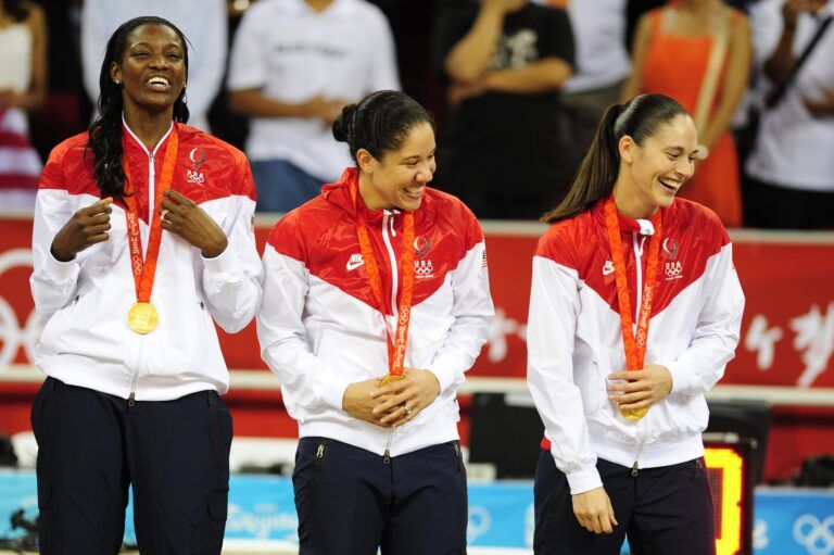 Aug. 23, 2008; Beijing, CHINA; United States players Delisha Milton-Jones and Kara Lawson and Sue Bird react on the podium after the USA 92-65 victory against Autralia in the gold medal game at the Beijing Olympic Basketball Stadium in the 2008 Beijing Olympics.