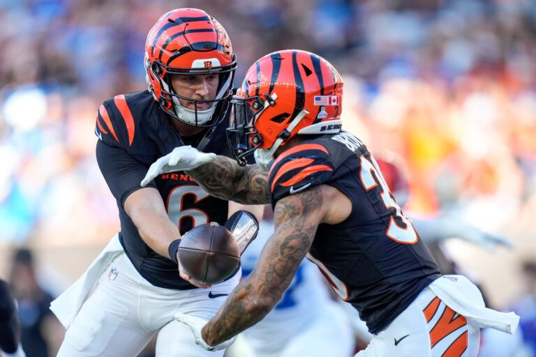 Cincinnati Bengals quarterback Jake Browning (6) hands off to running back Chase Brown (30) in the second quarter against the Detroit Lions at Paycor Stadium.