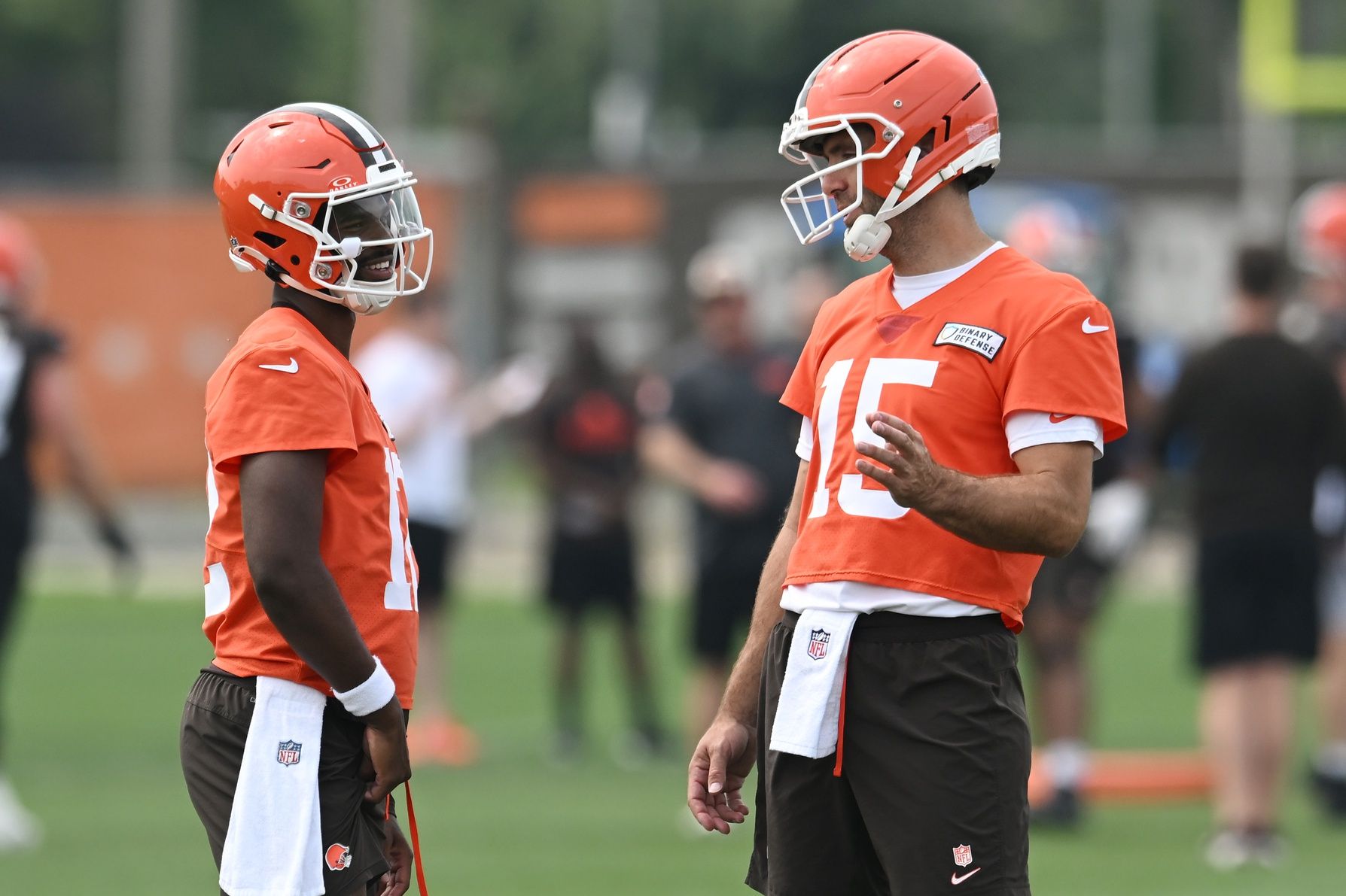 Cleveland Browns quarterback Joe Flacco (15) talks to quarterback Shedeur Sanders (12) during mini camp at CrossCountry Mortgage Campus.